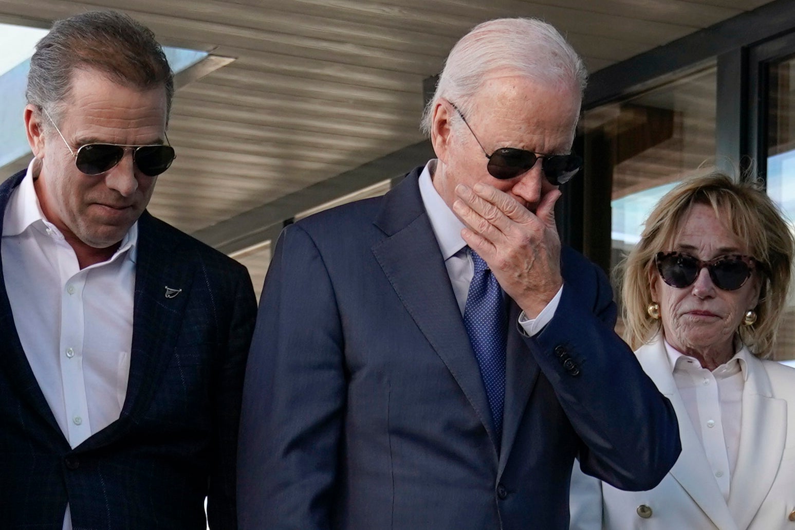 President Joe Biden stands with his son Hunter Biden, left, and sister Valerie Biden Owens, second from right, as he looks at a plaque dedicated to his late son Beau Biden while visiting Mayo Roscommon Hospice in County Mayo