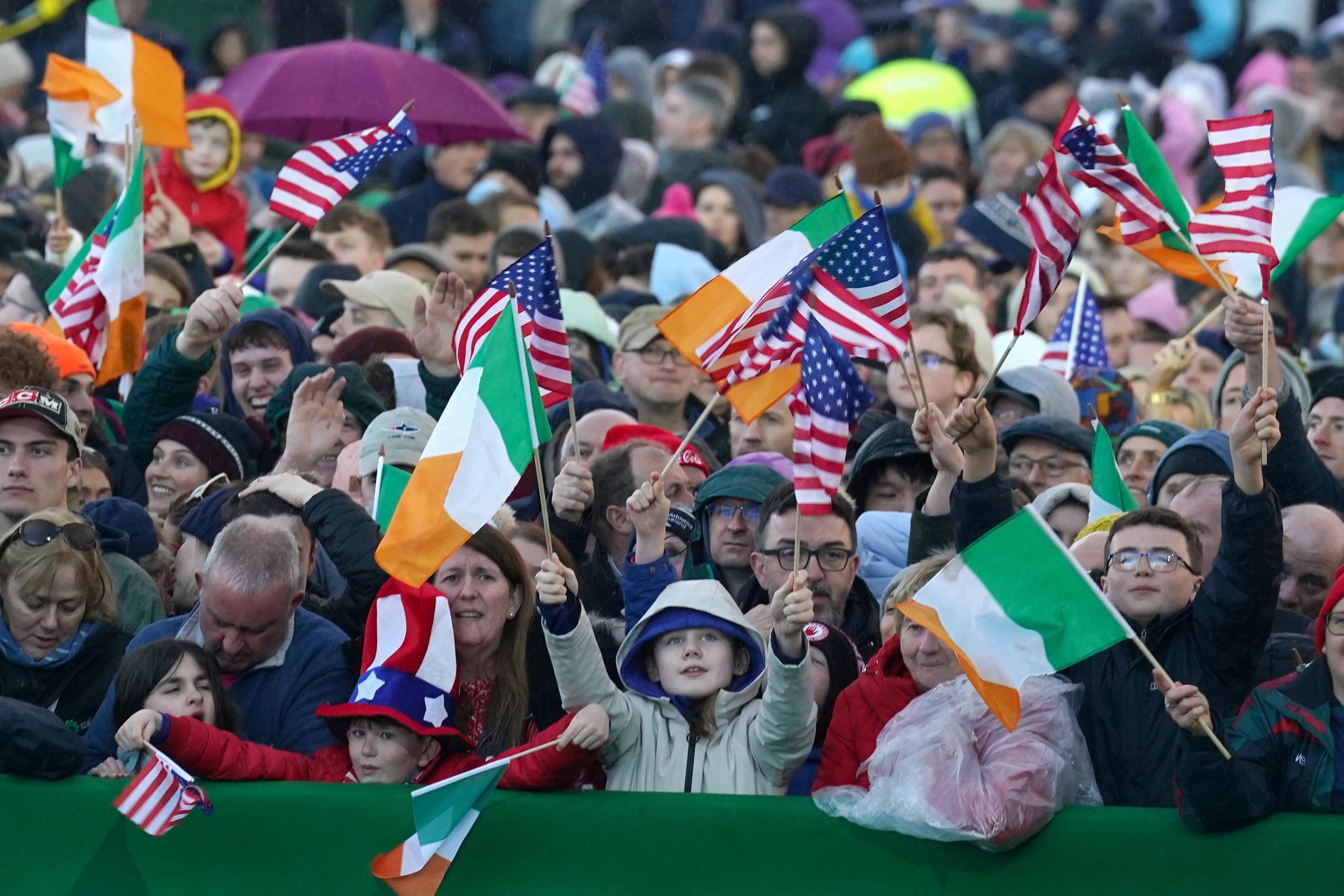 People wait for US President Joe Biden before he delivers a speech at St Muredach’s Cathedral in Ballina (Brian Lawless/PA)