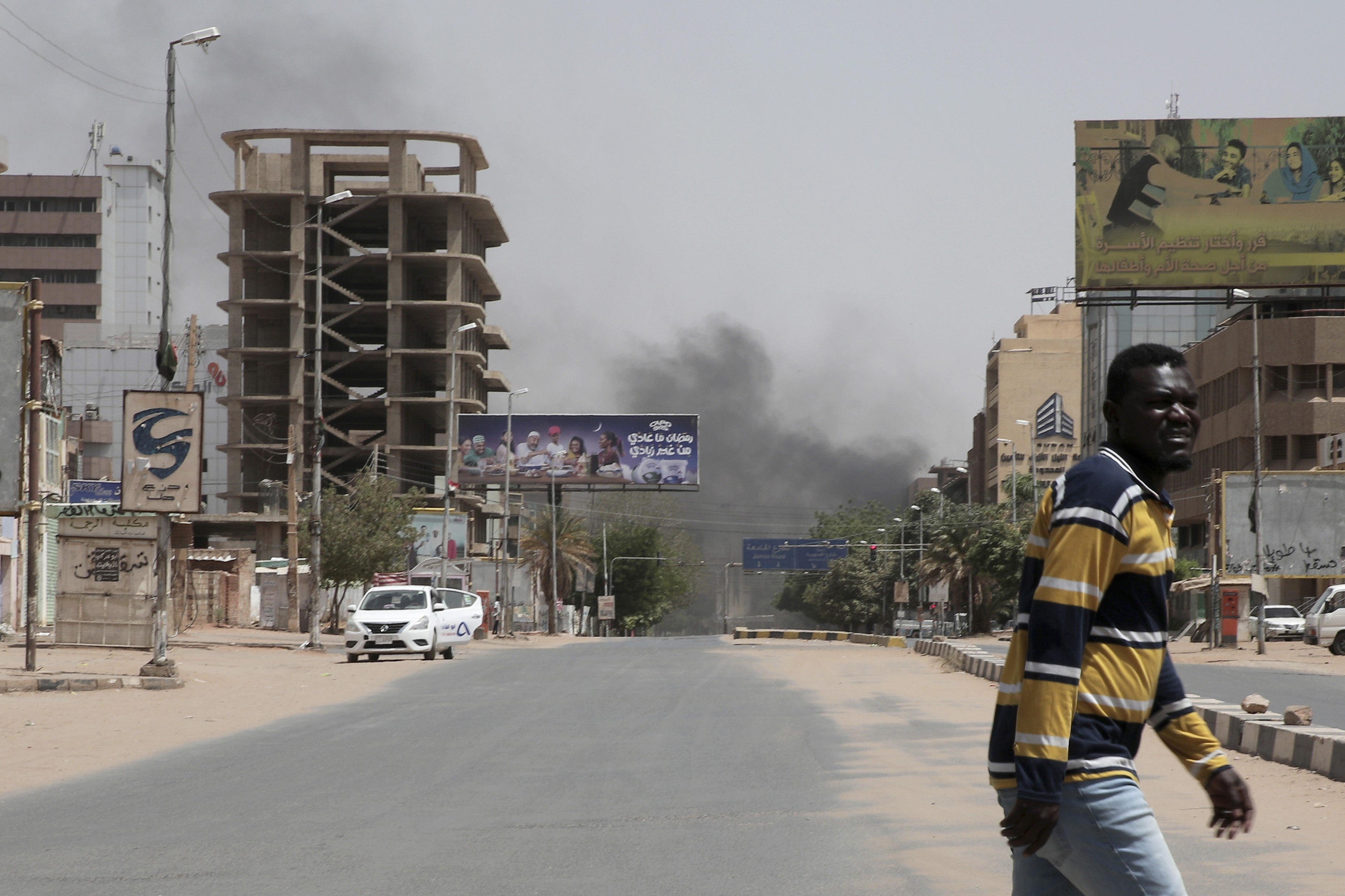 Smoke is seen rising in Khartoum as the power struggle between Sudan’s military and the country’s powerful paramilitary continues