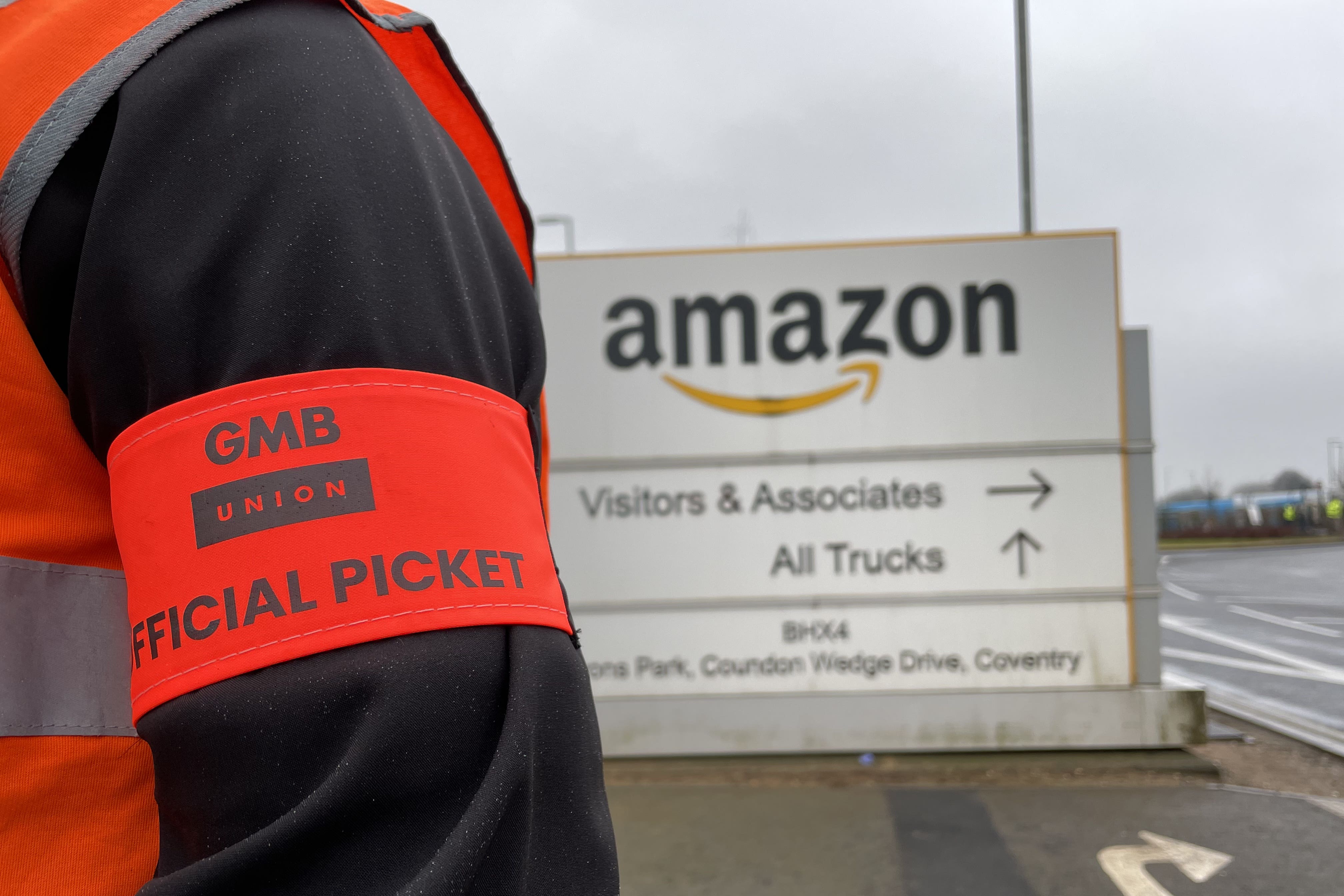 Members of the GMB union on the picket line outside the Amazon fulfilment centre in Coventry earlier this year (Phil Barnett/PA)