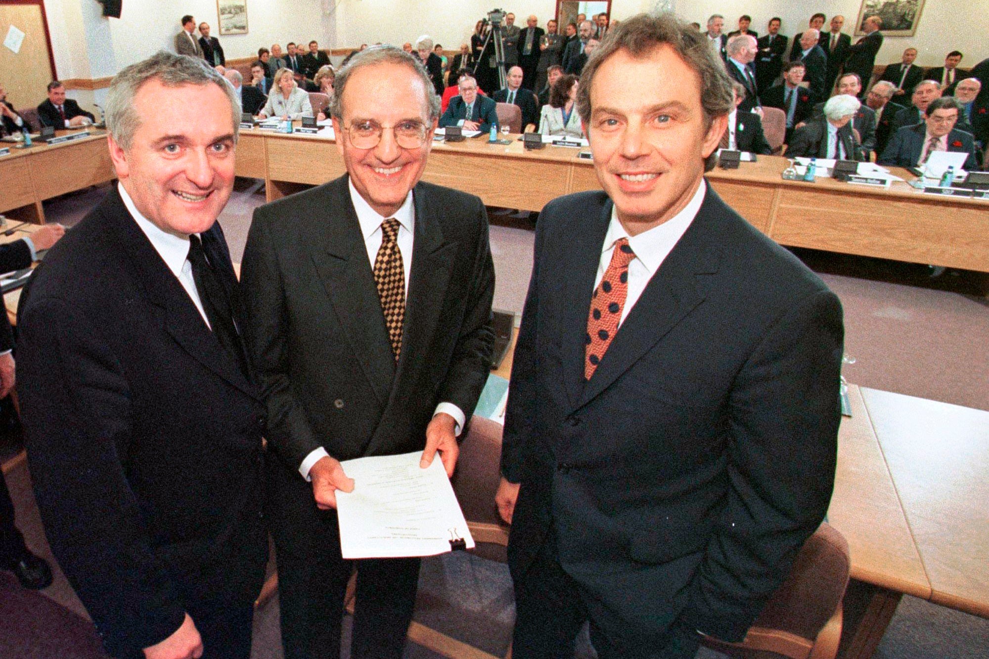 Irish prime minister Bertie Ahern (left), US Senator George Mitchell (centre) and British prime minister Tony Blair pose together after signing the Good Friday Agreement in Belfast in April 1998