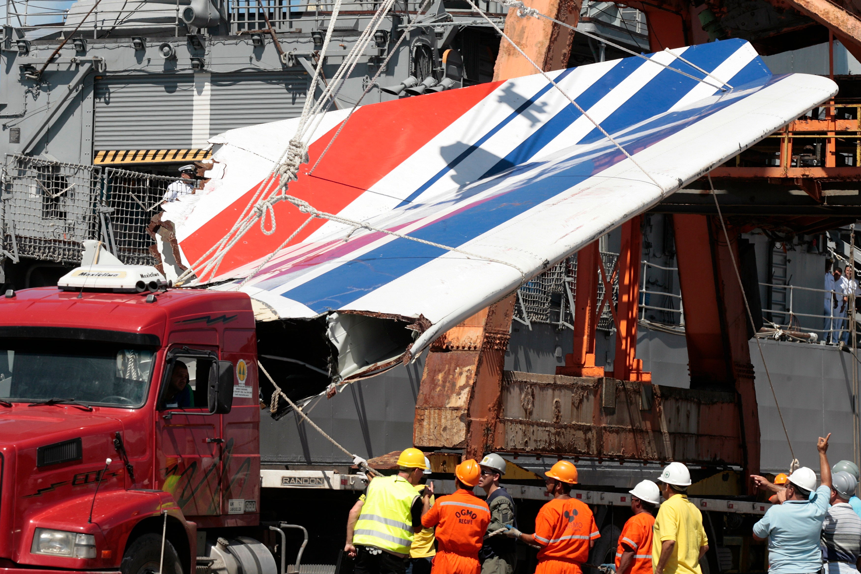 Workers unloading debris, belonging to the crashed Air France flight in 2009