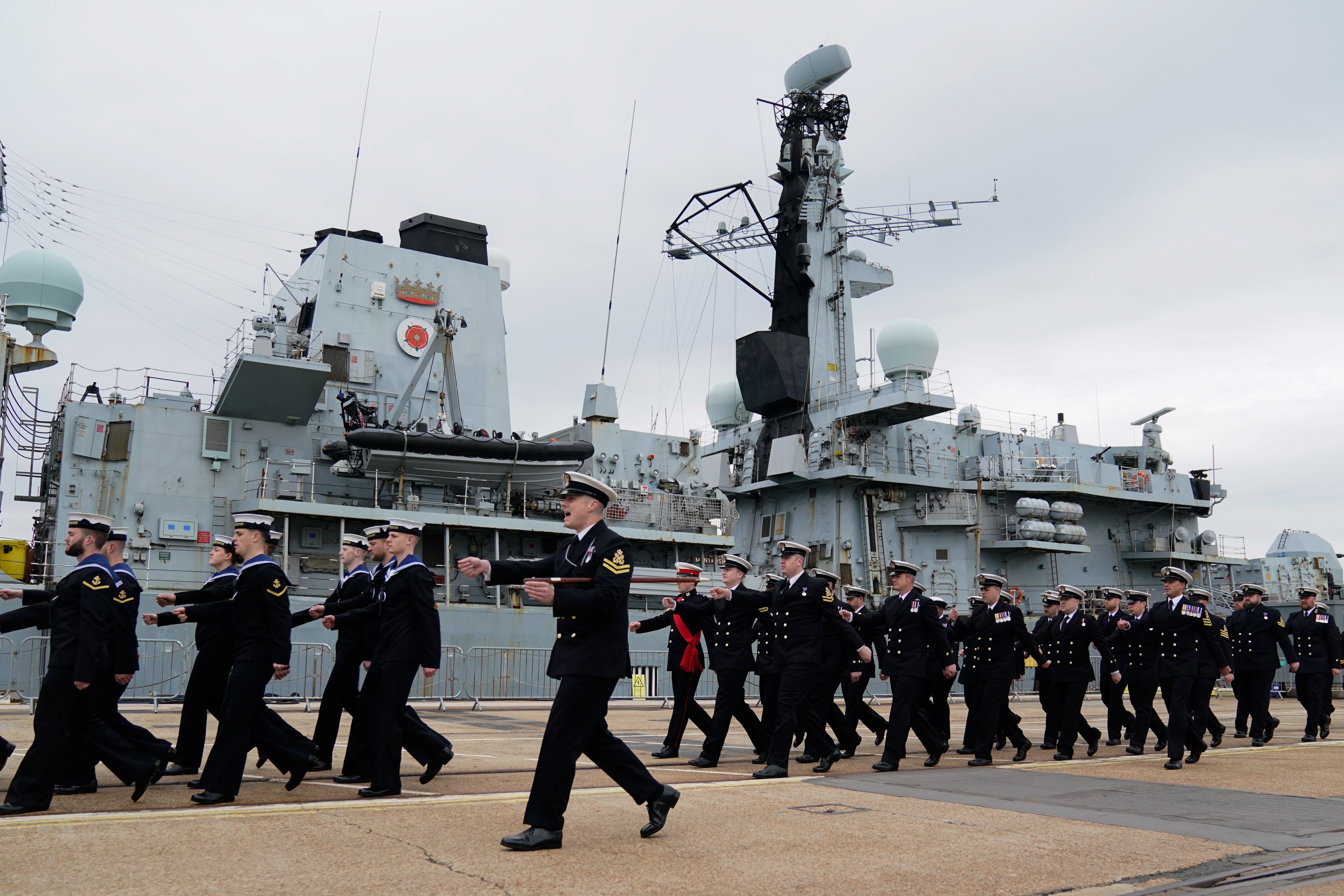 Members of the ship’s company march past HMS Montrose during it’s decommissioning ceremony at His Majesty’s Naval Base in Portsmouth, concluding over 30 years of operations and deployments across the globe. Picture date: Monday April 17, 2023.