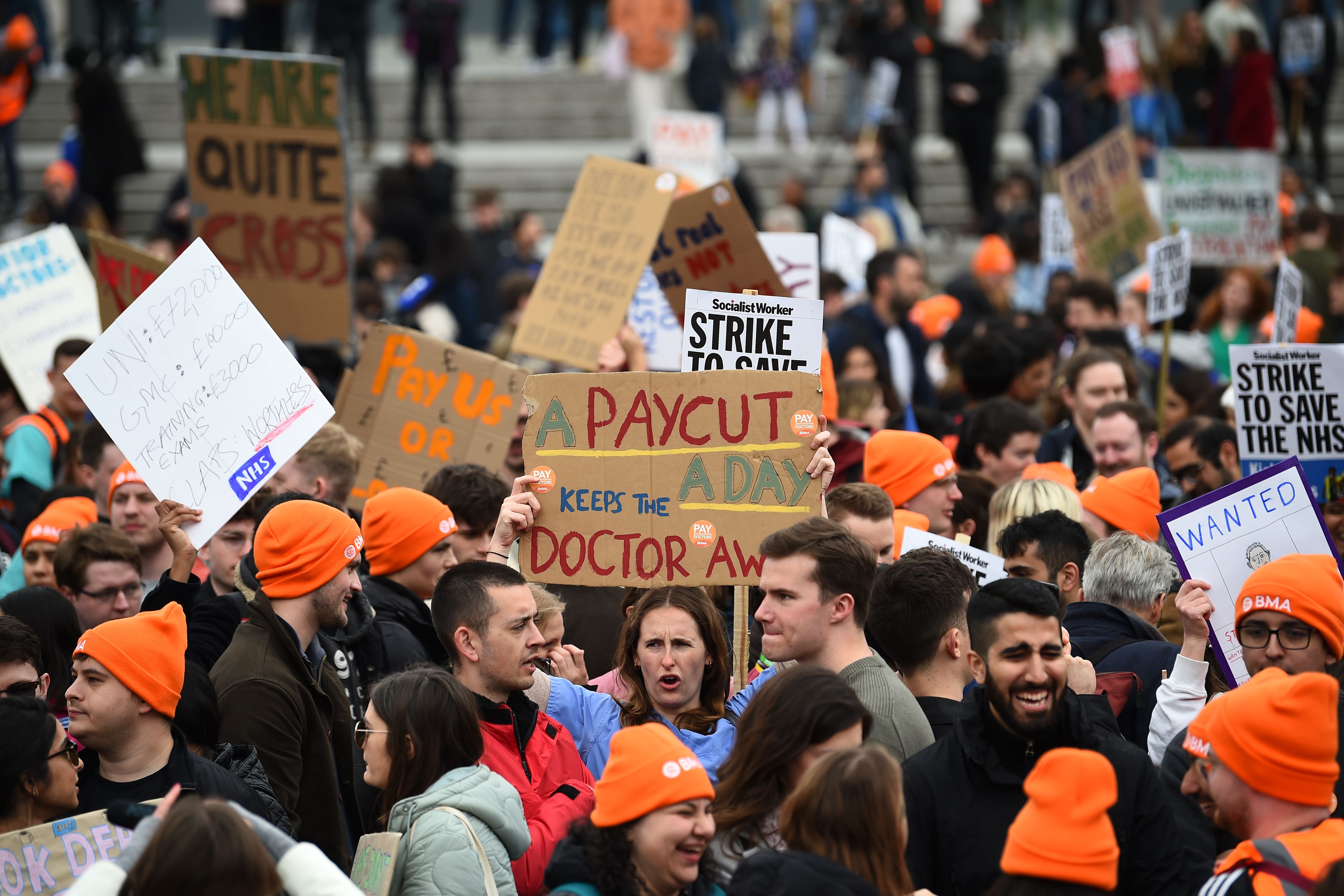 People take part in a rally in Trafalgar Square in London, in support of striking NHS junior doctors, as the British Medical Association holds a 96-hour walkout in a dispute over pay (Annabel Lee-Ellis/PA)