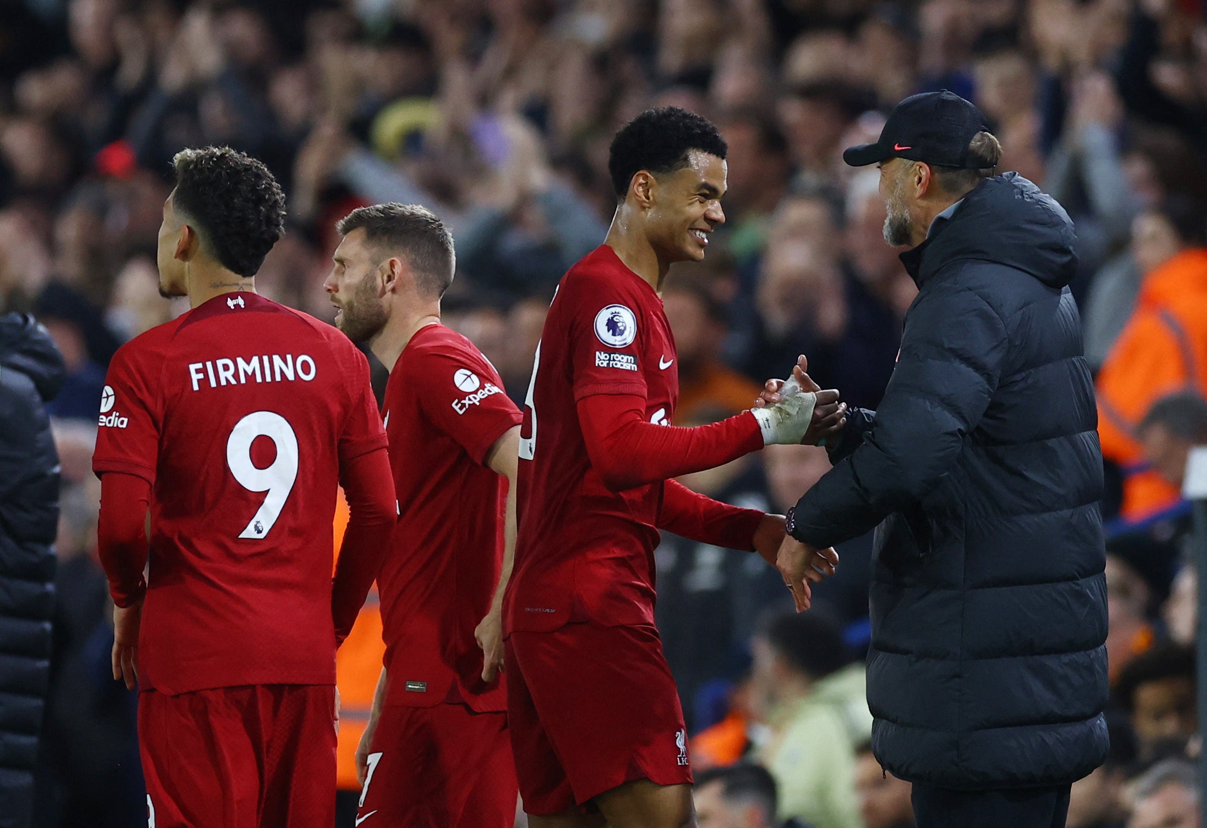 Cody Gakpo is greeted by Klopp after the game