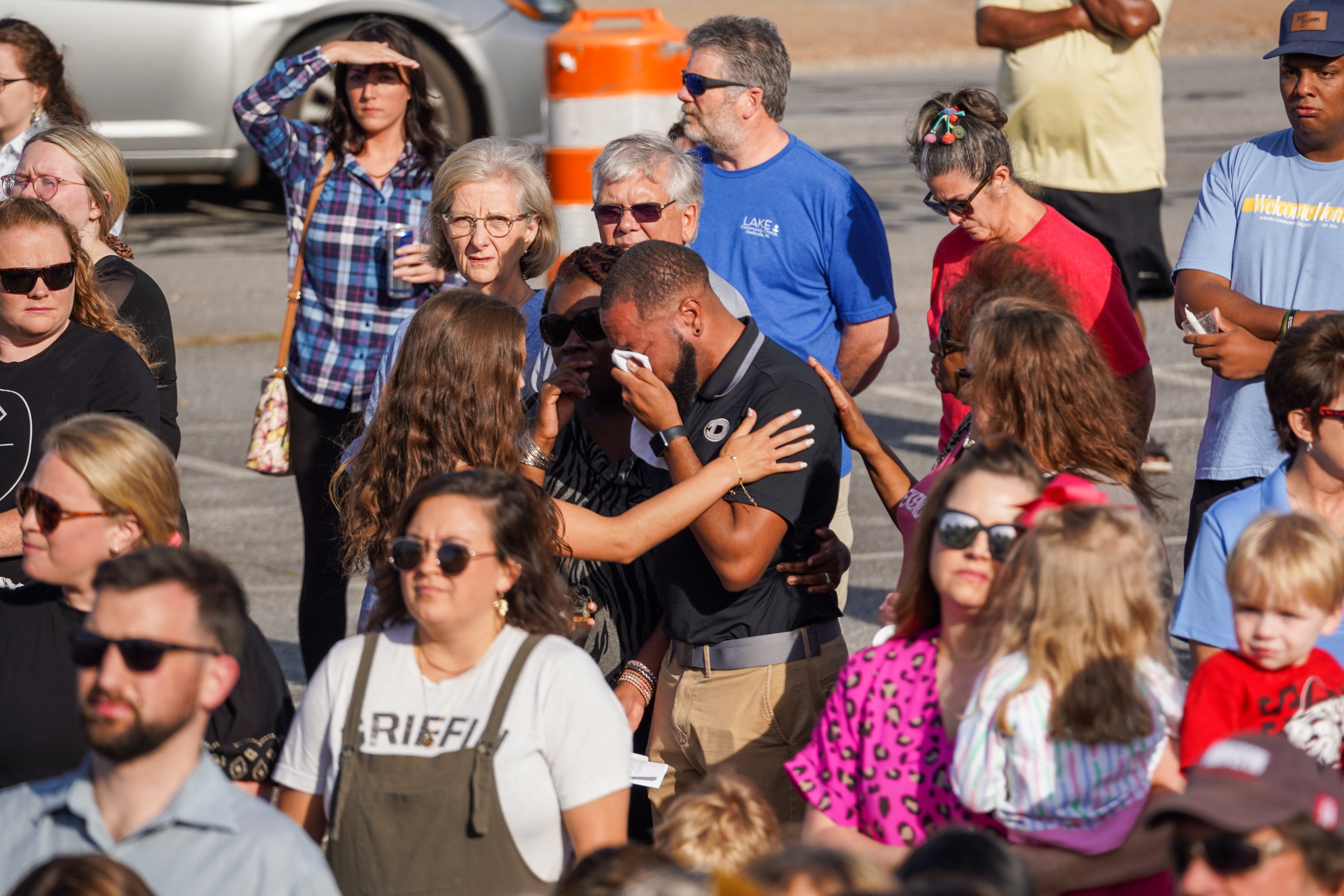 Mourners attend a vigil at the First Baptist Church of Dadeville