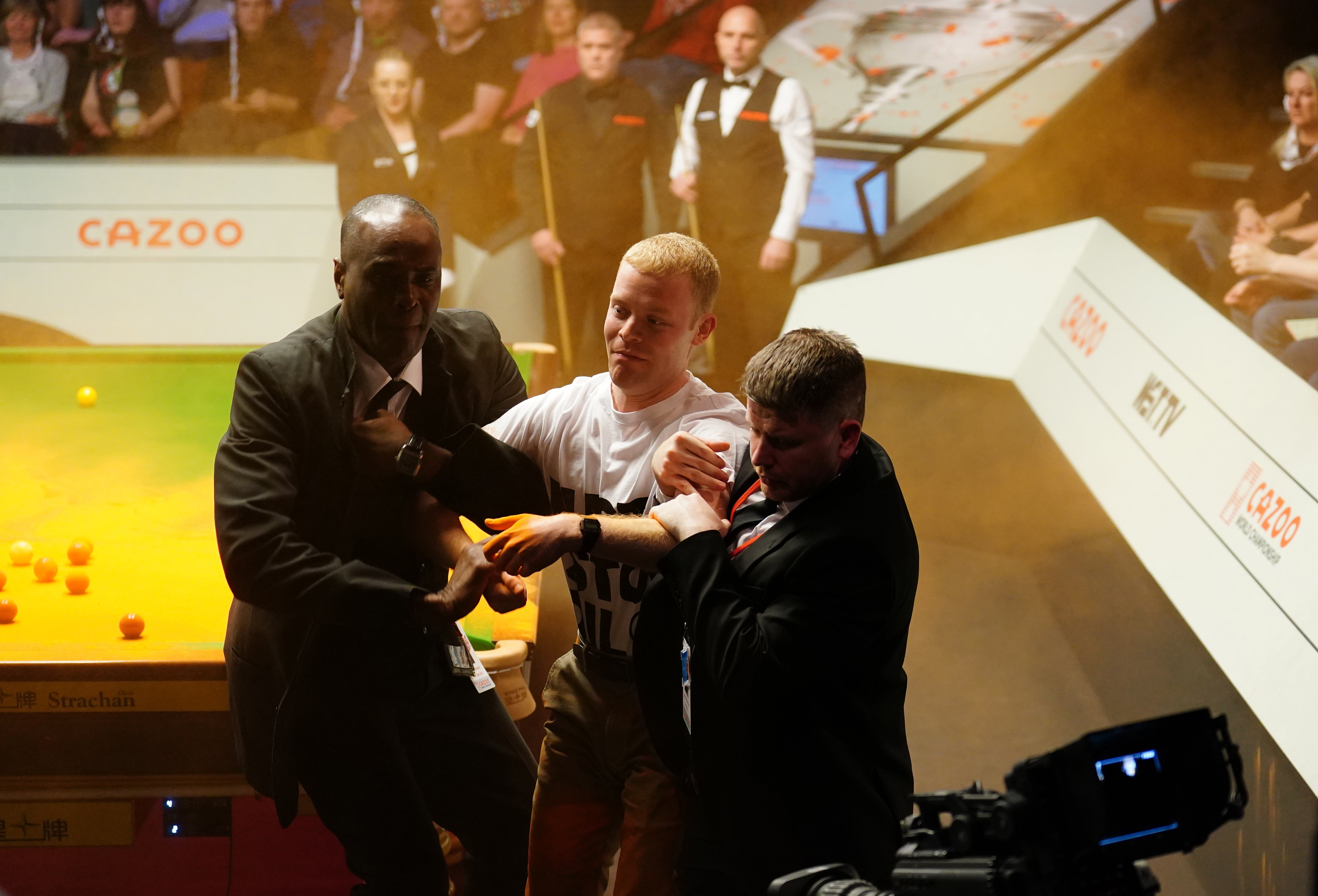 Whittingham escorted out by security at the Crucible