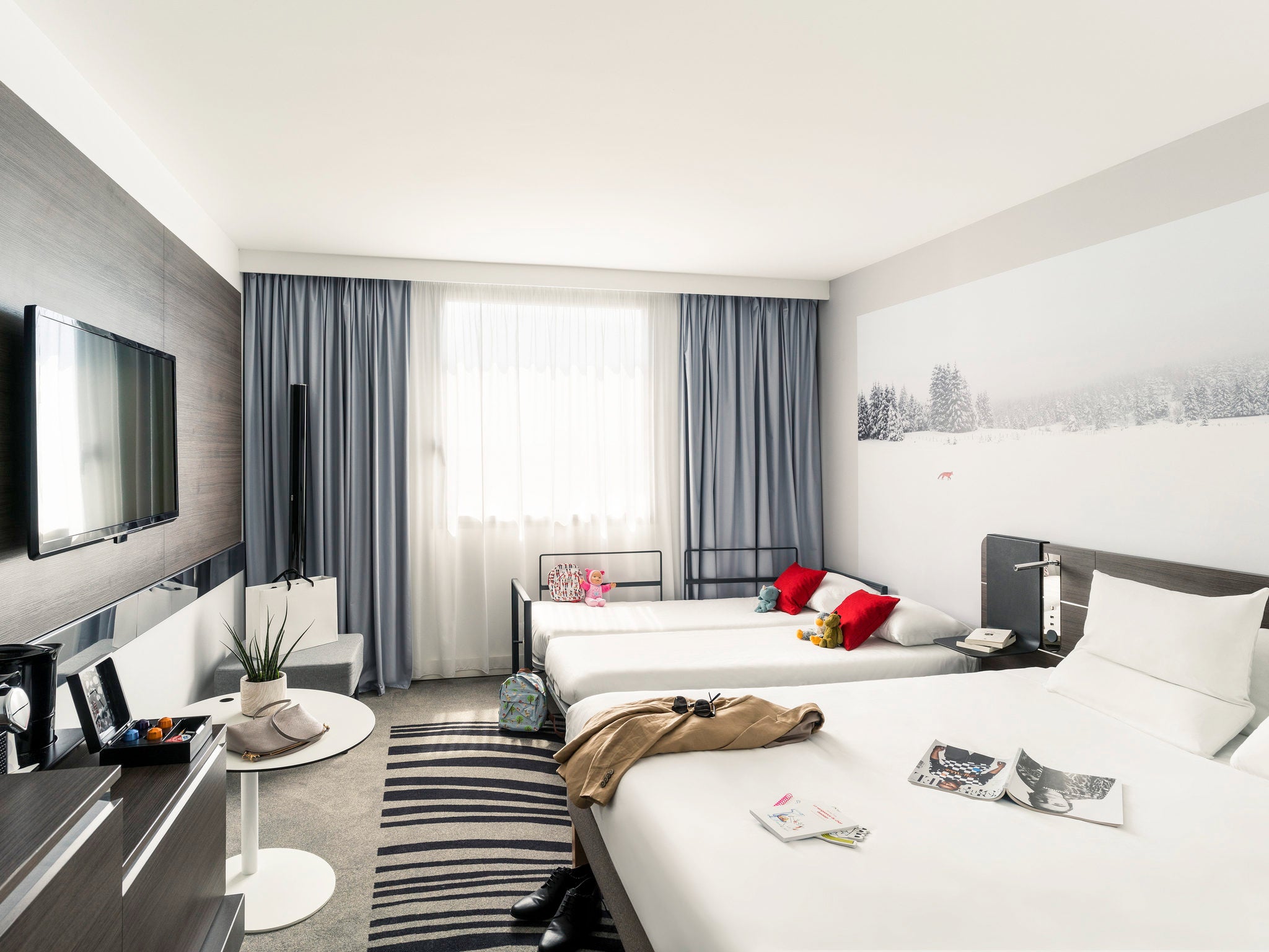 Family rooms at the Novotel Paris Gare Montparnasse comfortably sleep four