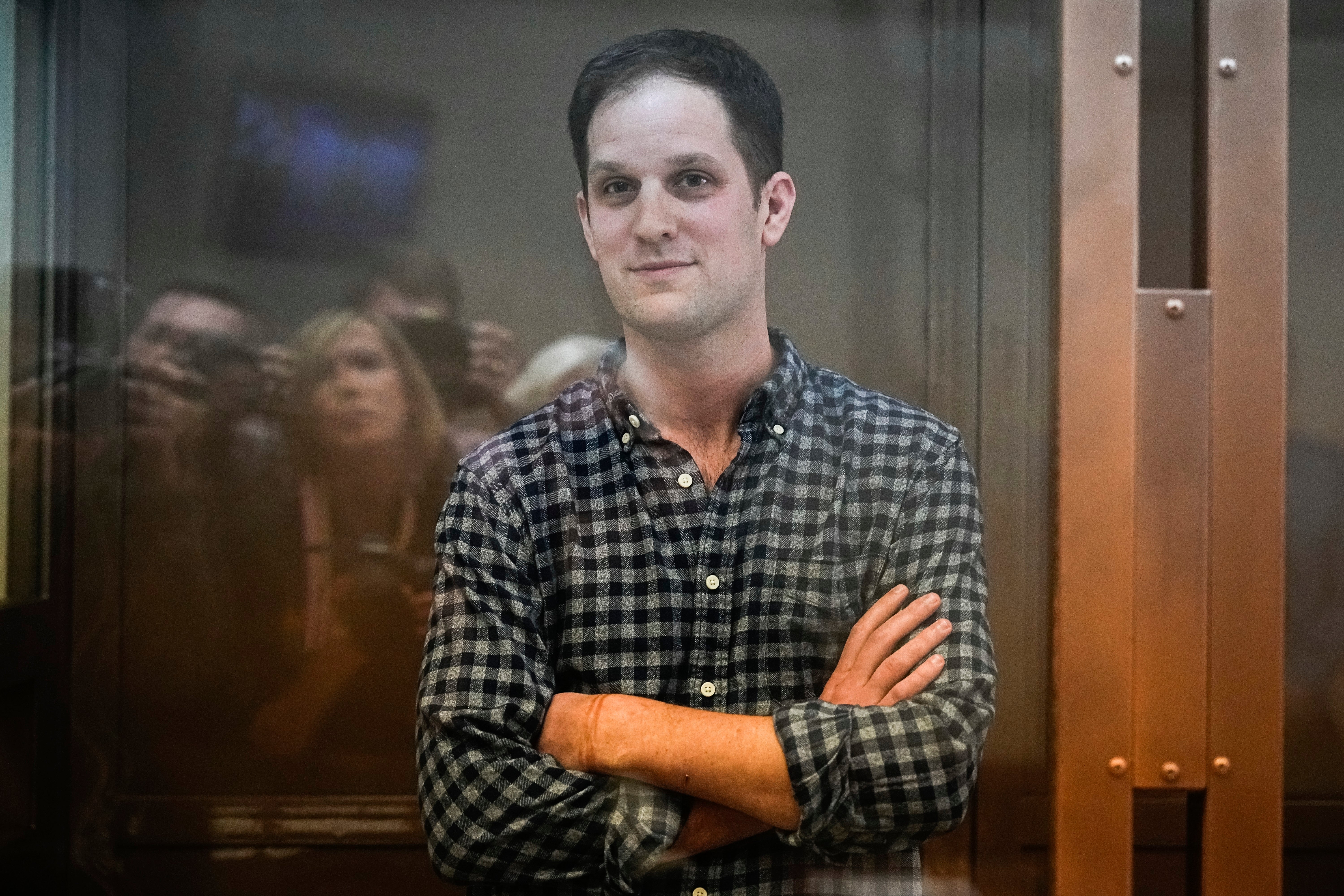 Wall Street Journal reporter Evan Gershkovich stands in a glass cage in a courtroom at the Moscow City Court, in Moscow, Russia, on Tuesday, April 18, 2023