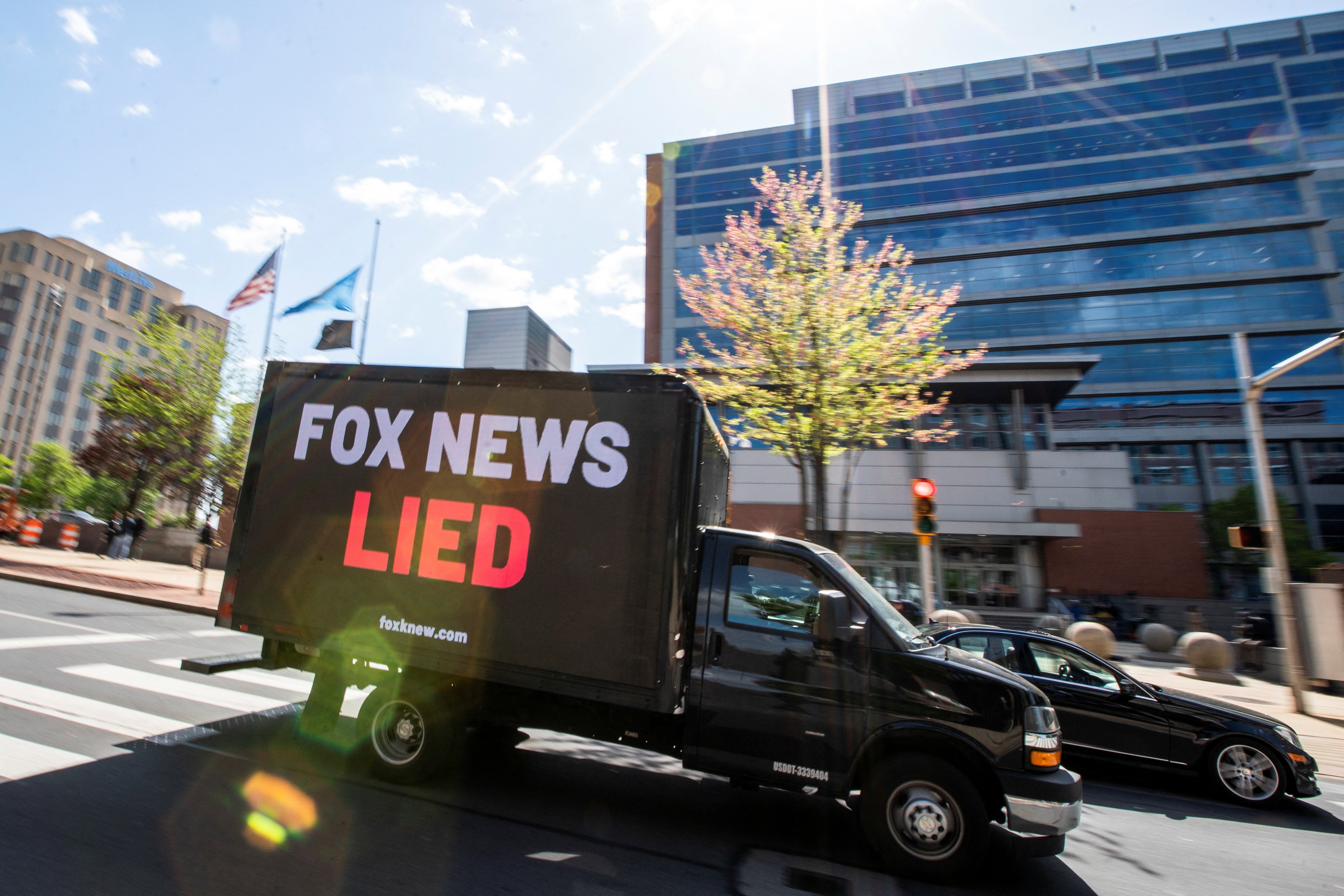 A truck drives in front of the courthouse as jury selection continues