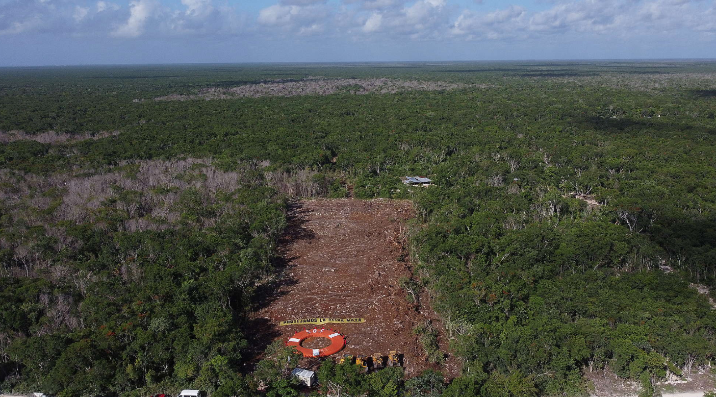 Greenpeace activists protest at a Maya Train construction site with a sign which reads ‘Protect the Mayan Jungle’