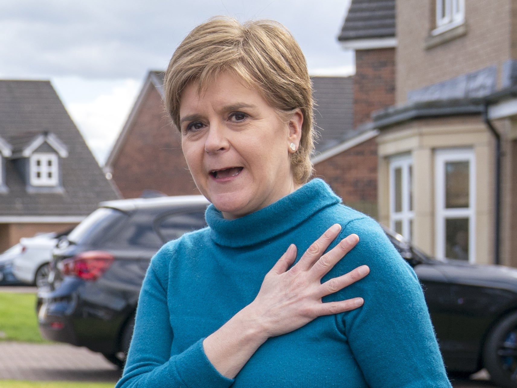 Ex-SNP boss Nicola Sturgeon outside her home - searched by police