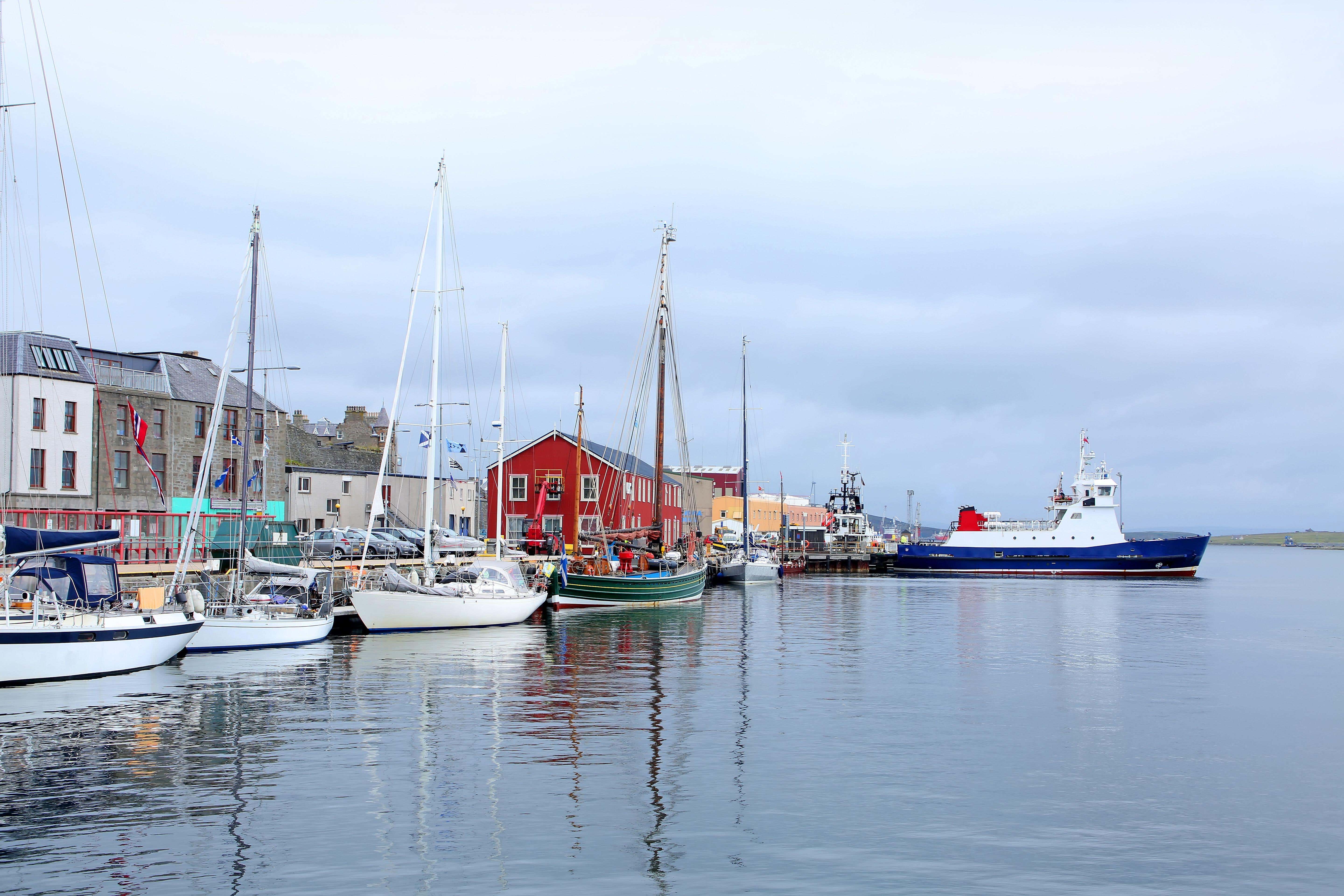 Fishing boats, lifeboat & buildings in the background in Lerwick, Shetland Islands (Alamy/PA)