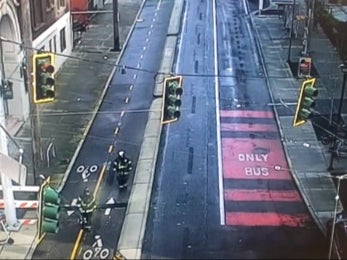 Firefighters walk down a closed city street in Seattle