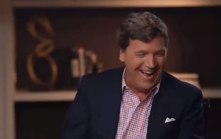 Fox host Tucker Carlson laughs as Elon Musk discusses Twitter layoffs