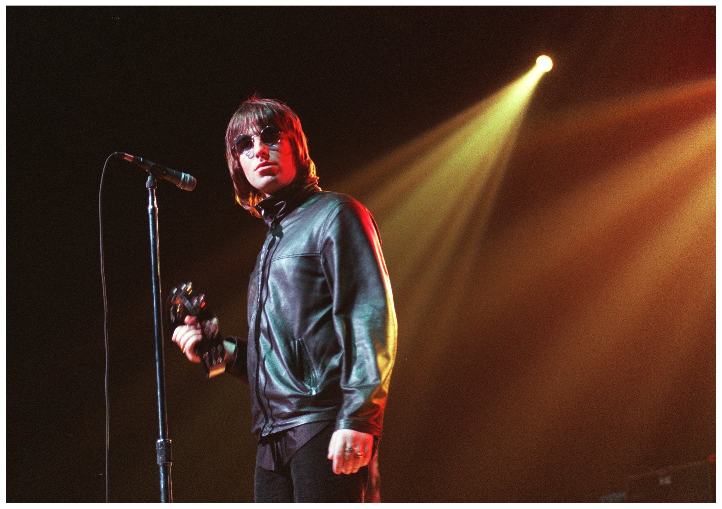 Gallagher on stage with Oasis in 2000