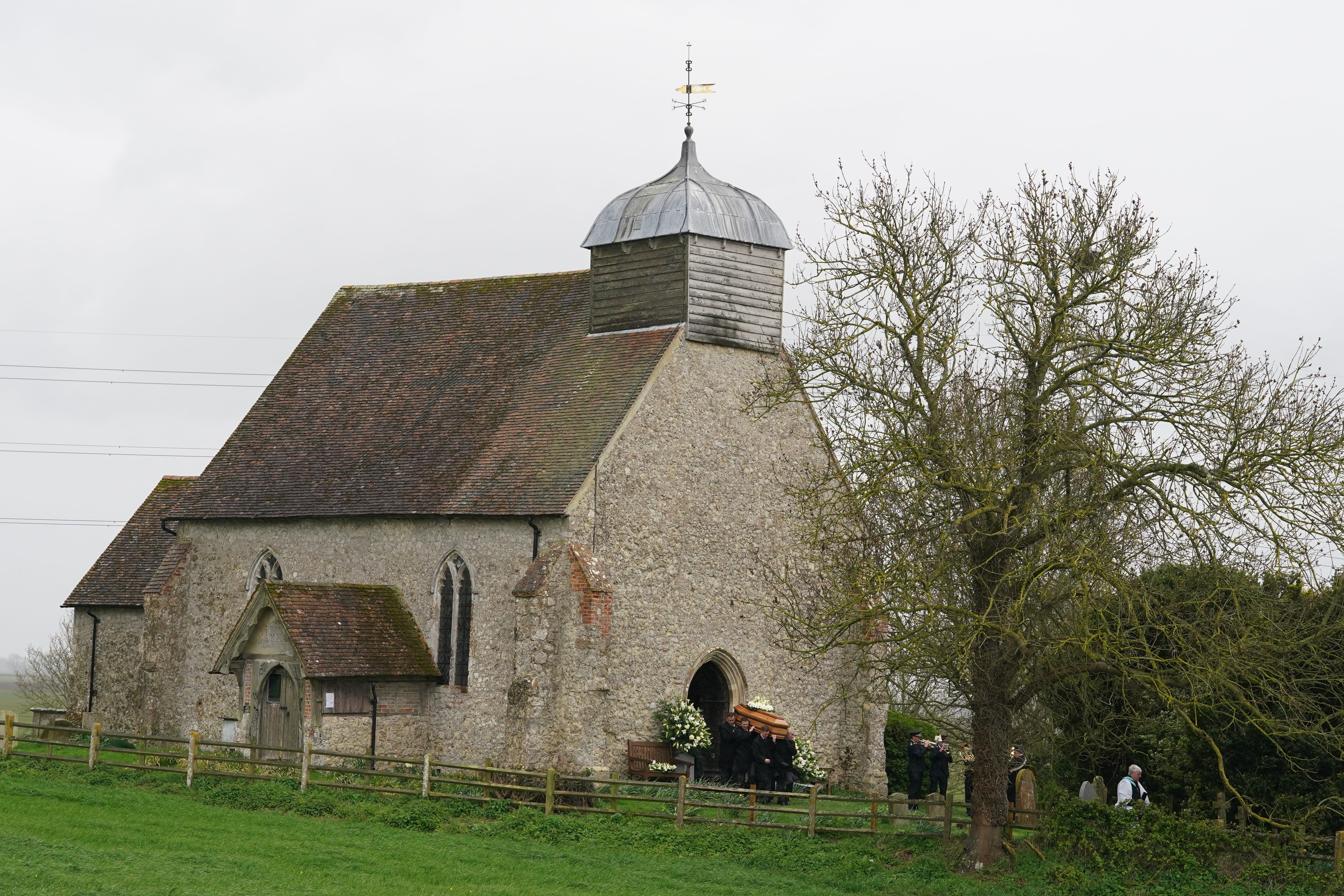 The coffin of Paul O’Grady is taken from St Rumwold’s Church in Kent (Gareth Fuller/PA)