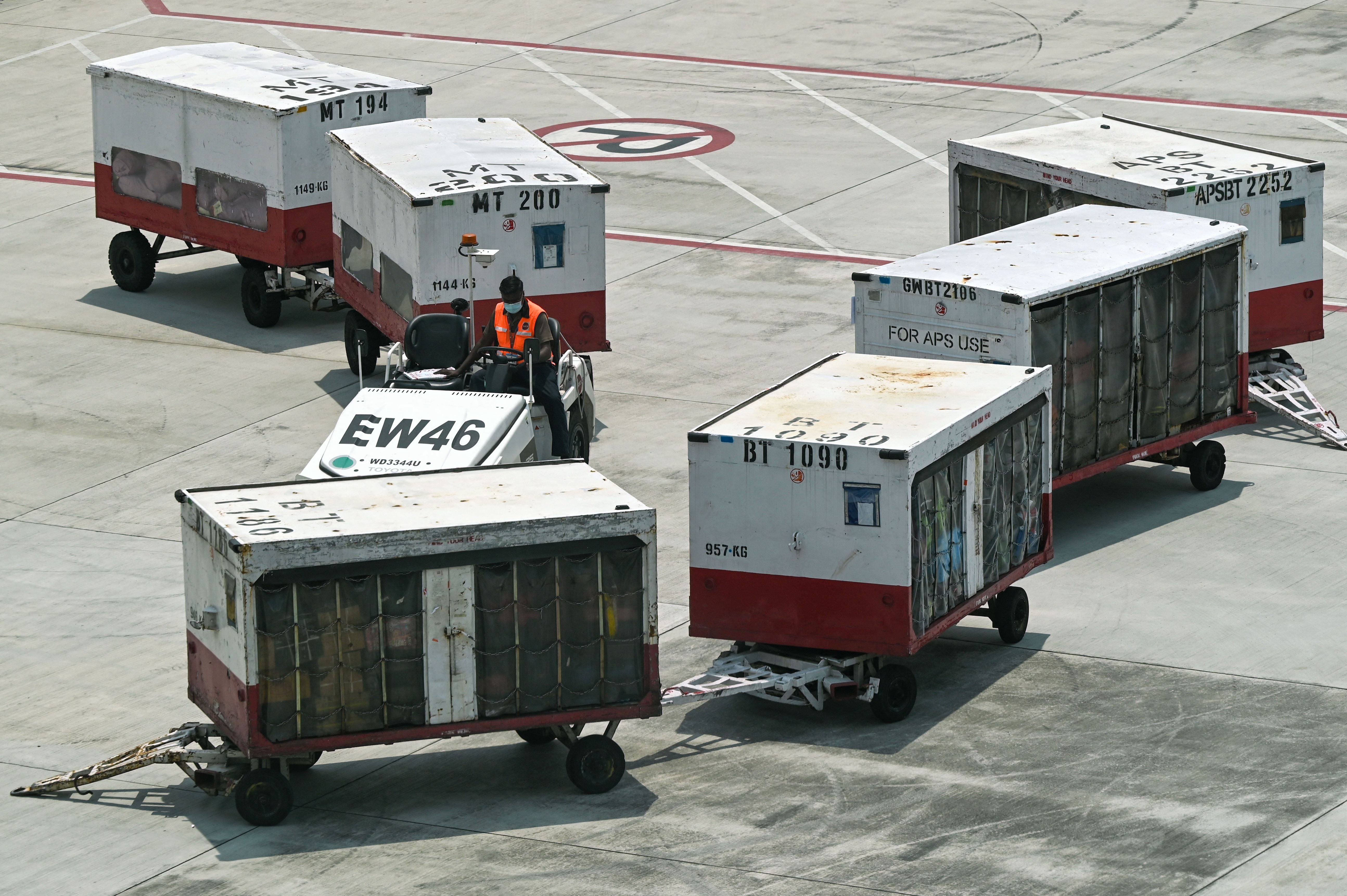 Representative image: An airport staff member tows cargo along the tarmac