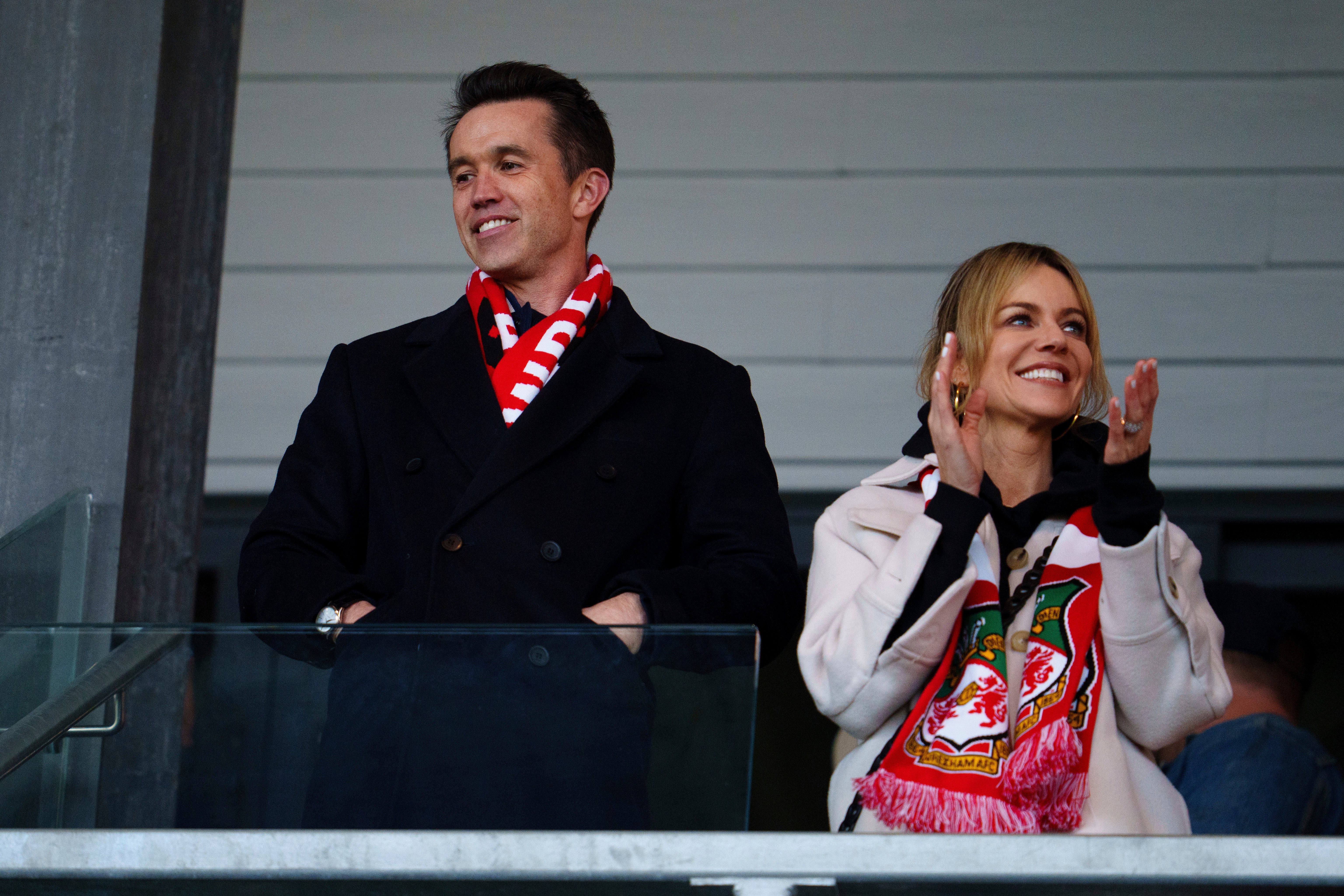 McElhenney and Olson at a football game in Wrexham