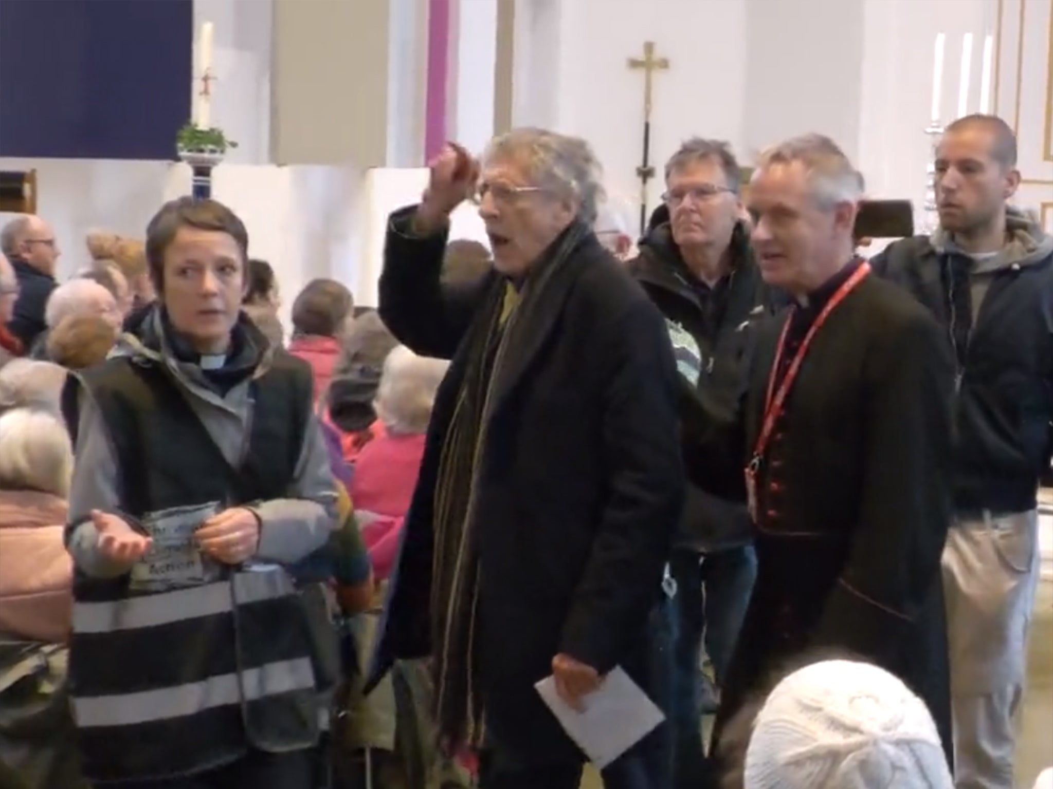 Corybn (second from left) was led out of the church ranting