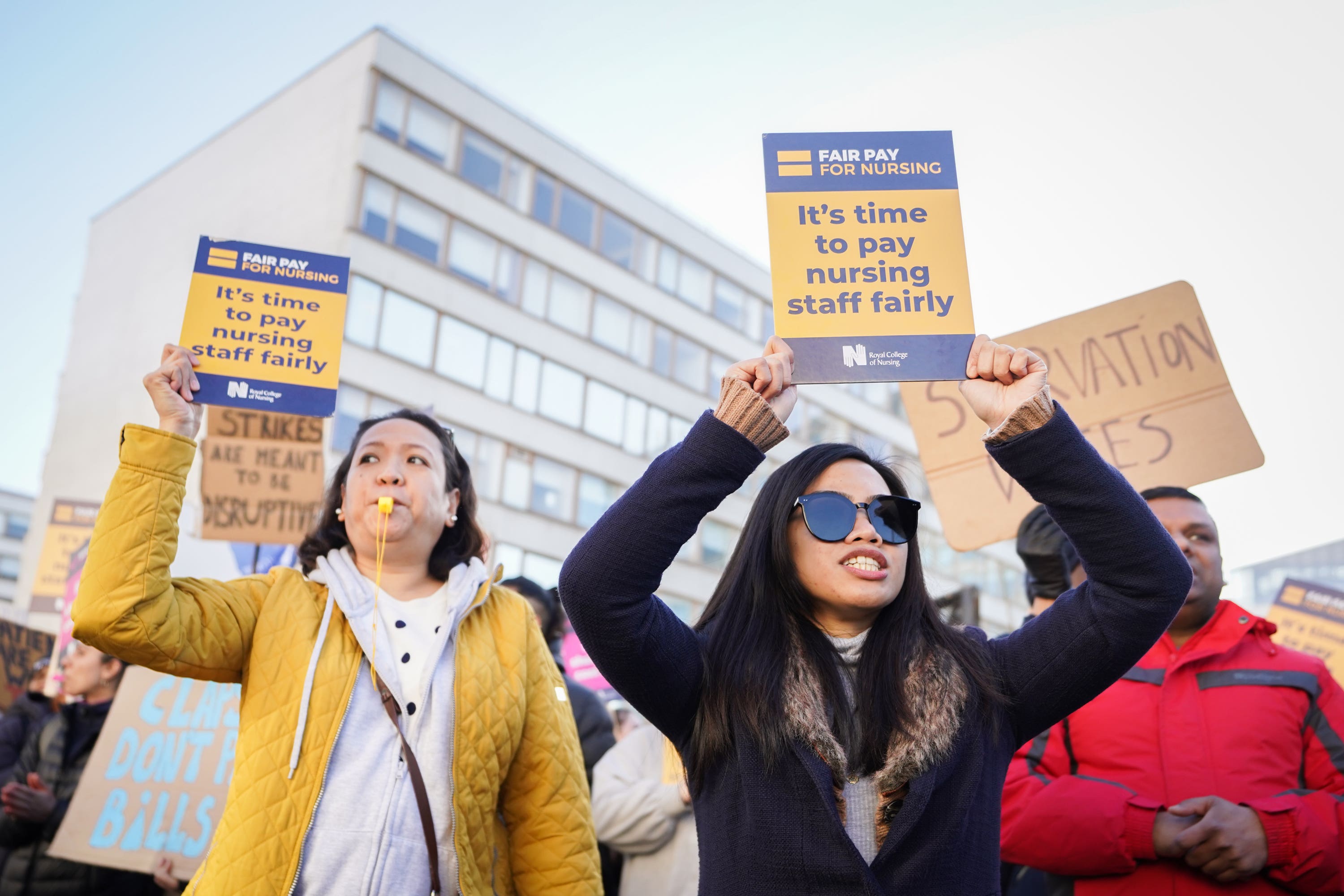 Workers on the picket line outside St Thomas’ Hospital in London (PA)