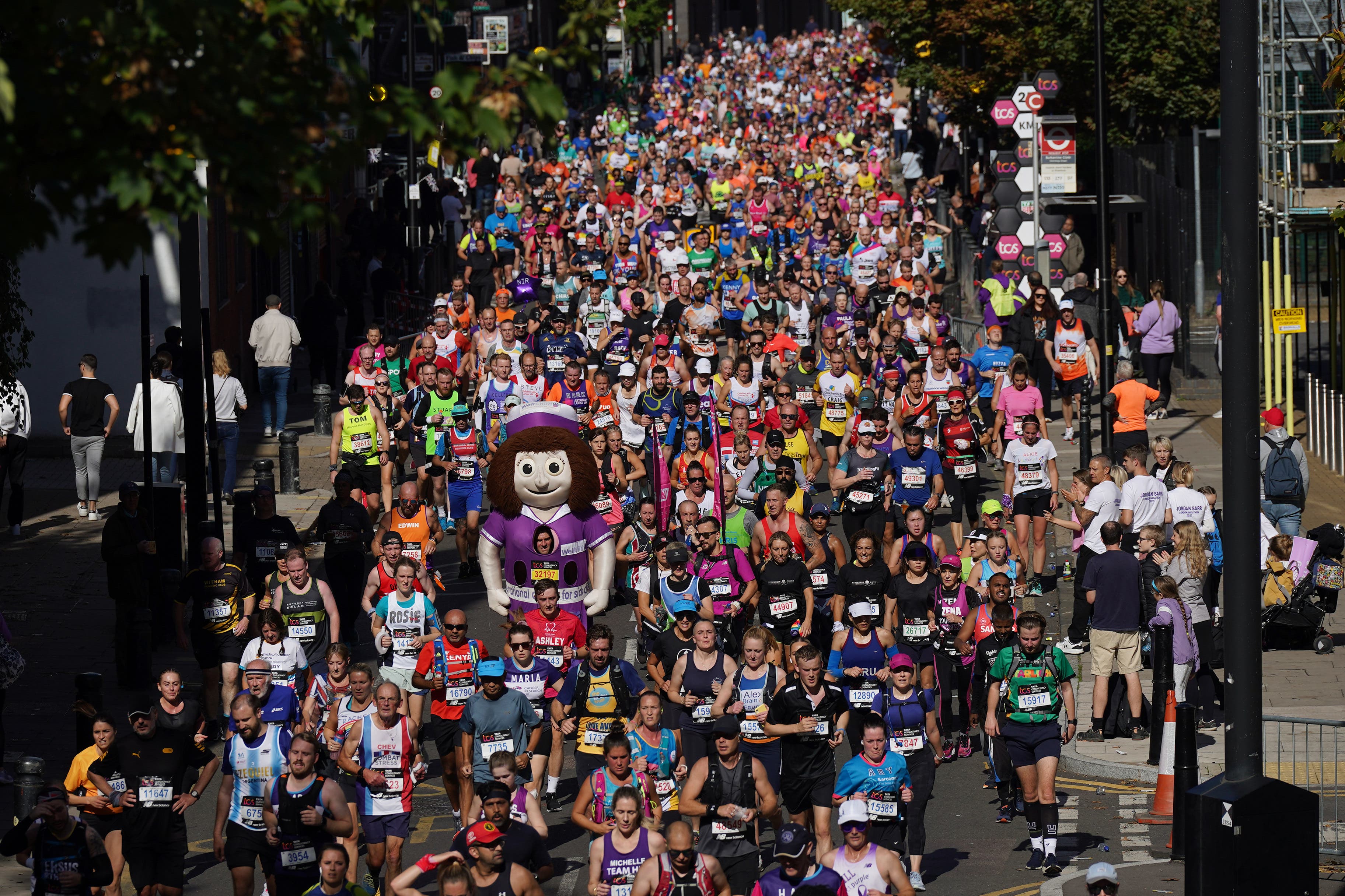 Runners reach the Isle of Dogs during the TCS London Marathon 2022 (Yui Mok/PA)