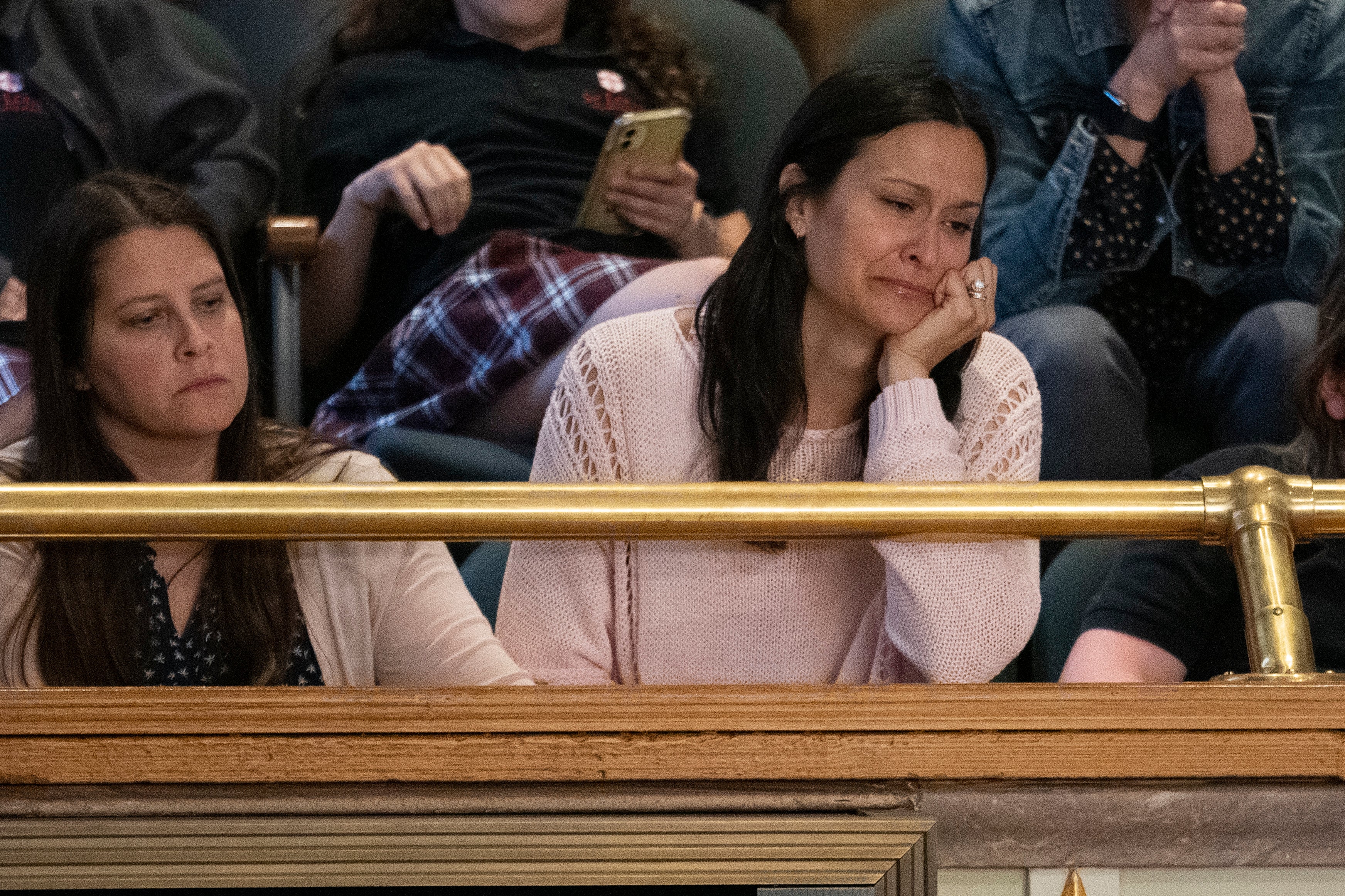 The mother of victim Evelyn Dieckhaus cries at a legislative session