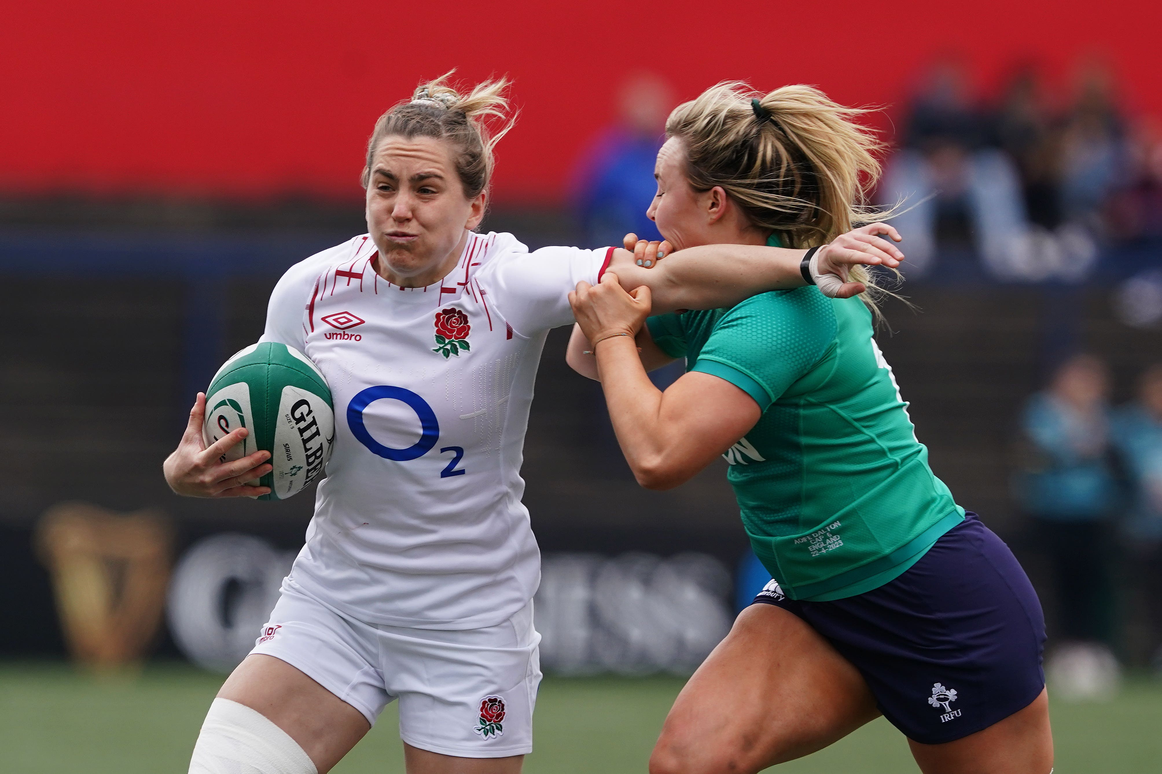 England’s Claudia MacDonald us tackled by Ireland’s Aoife Dalton (Brian Lawless/PA)