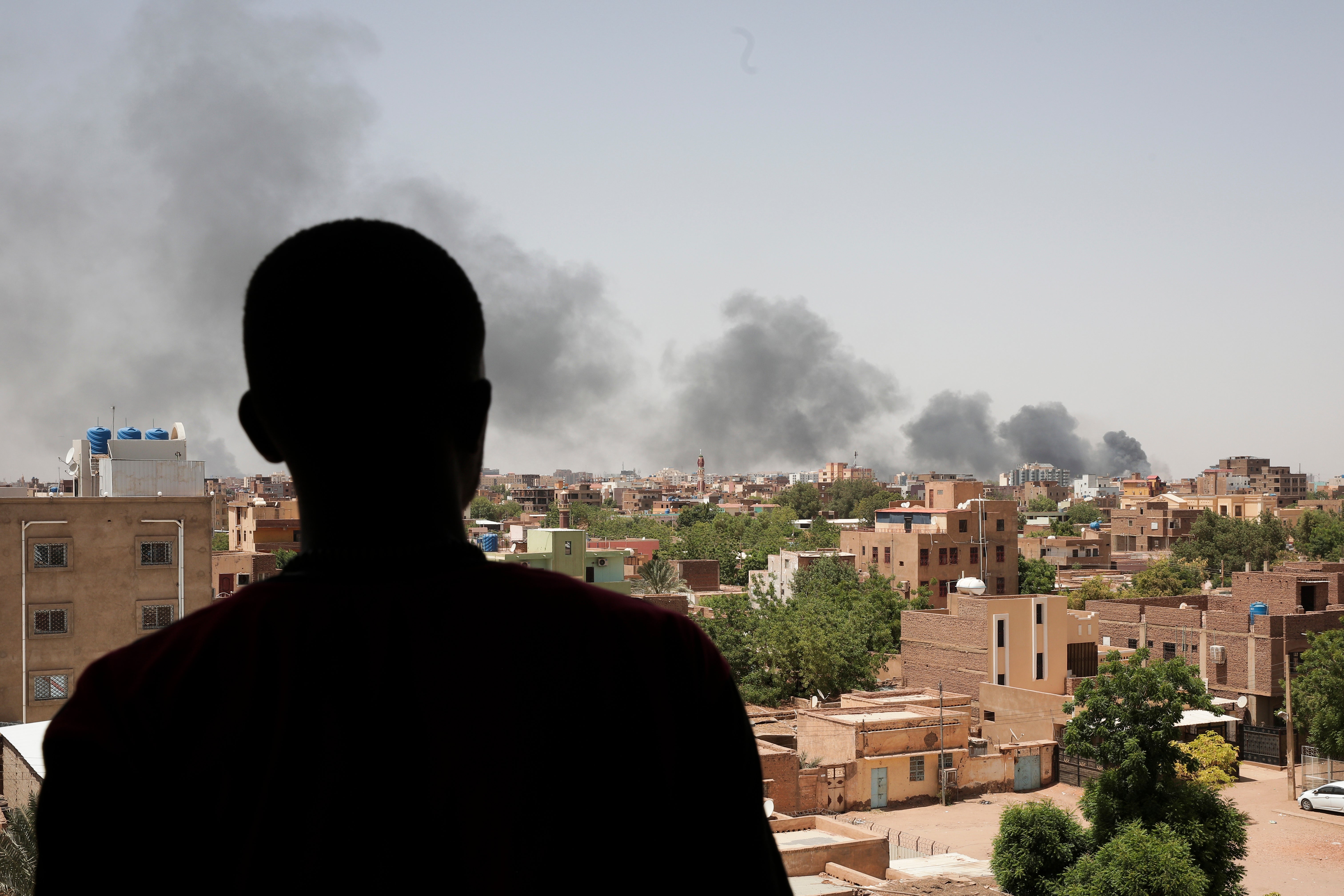 Smoke rose over Khartoum on Saturday as evacuations began