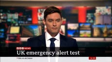 Moment BBC newsreader interrupted by emergency alert live on air