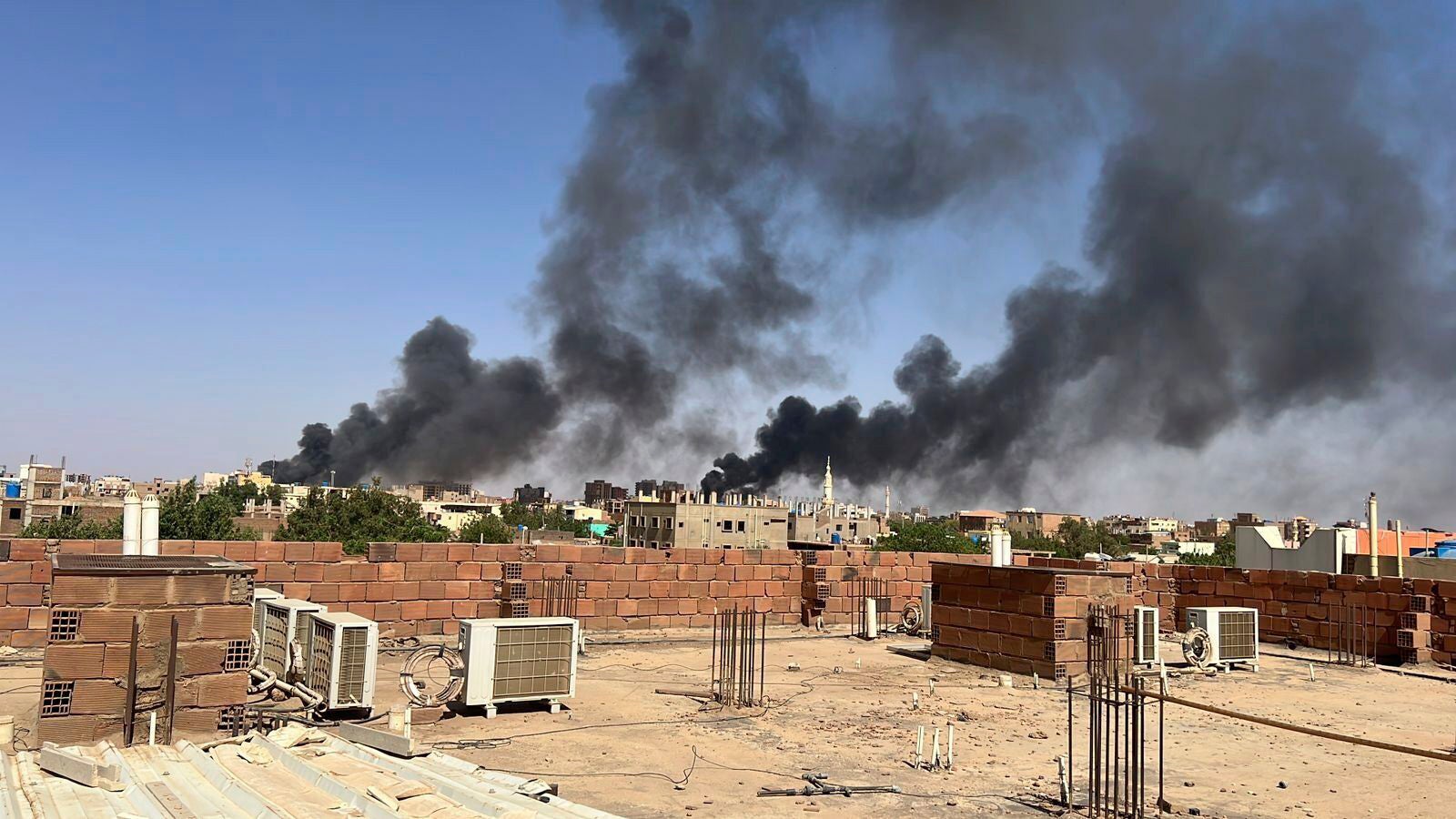 Smoke clouds the sky over Khartoum