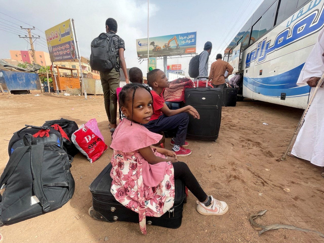 People in Khartoum flee clashes between the paramilitary RSF and the army