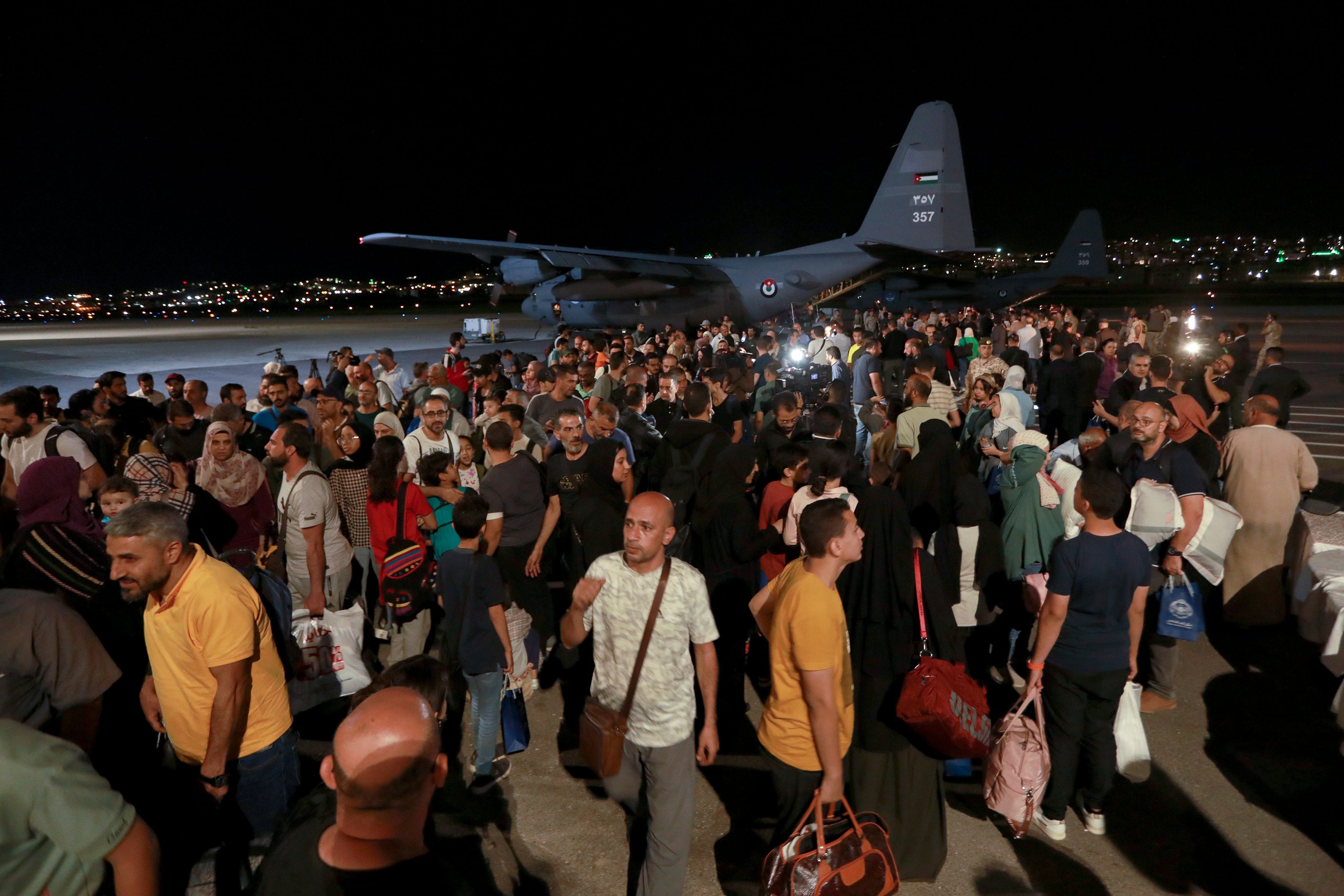 Jordanians evacuated from Sudan arrive at a military airport in Amman, Jordan