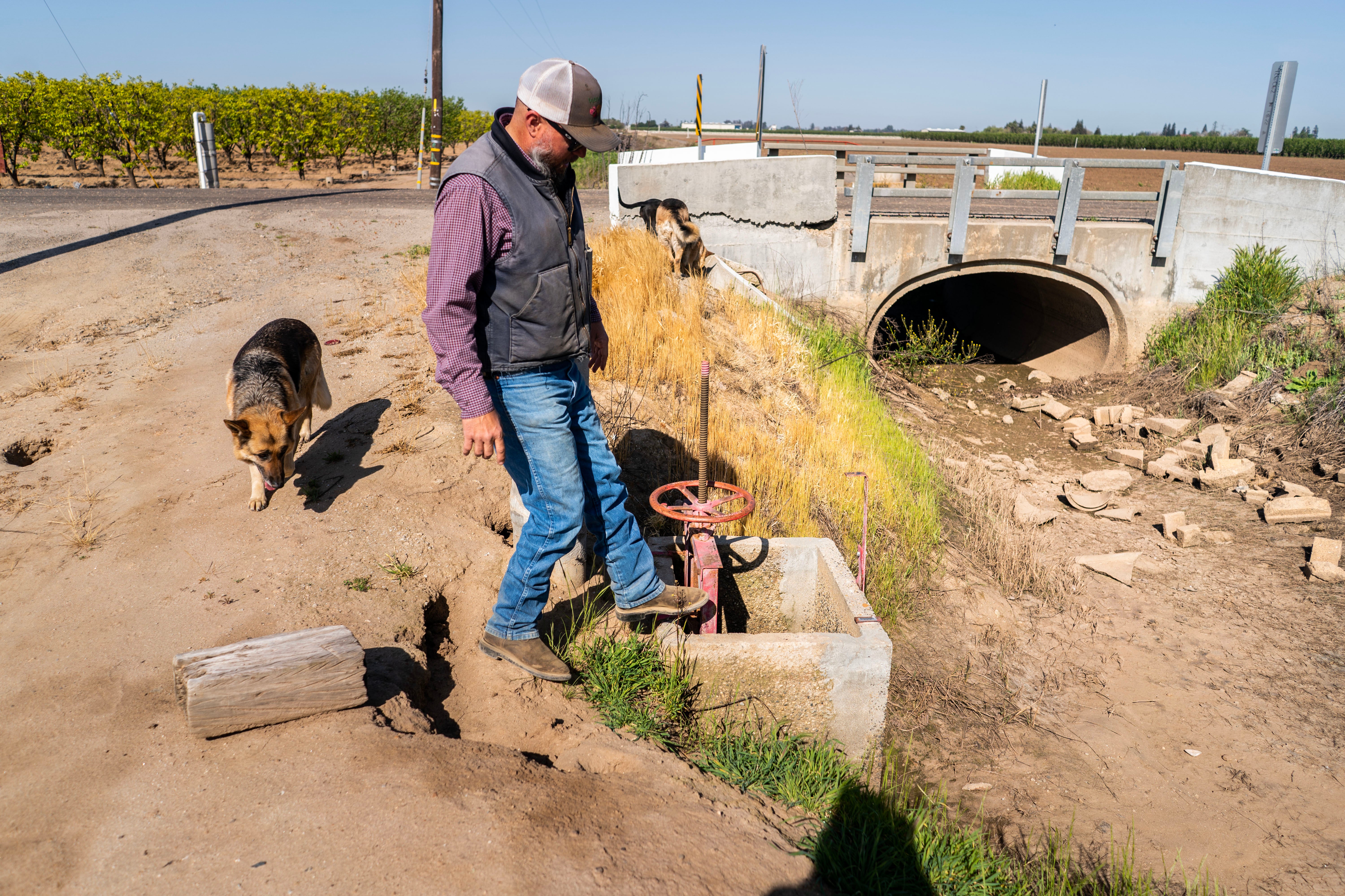 Jeff Noorigian checks his irrigation system, which is still dry