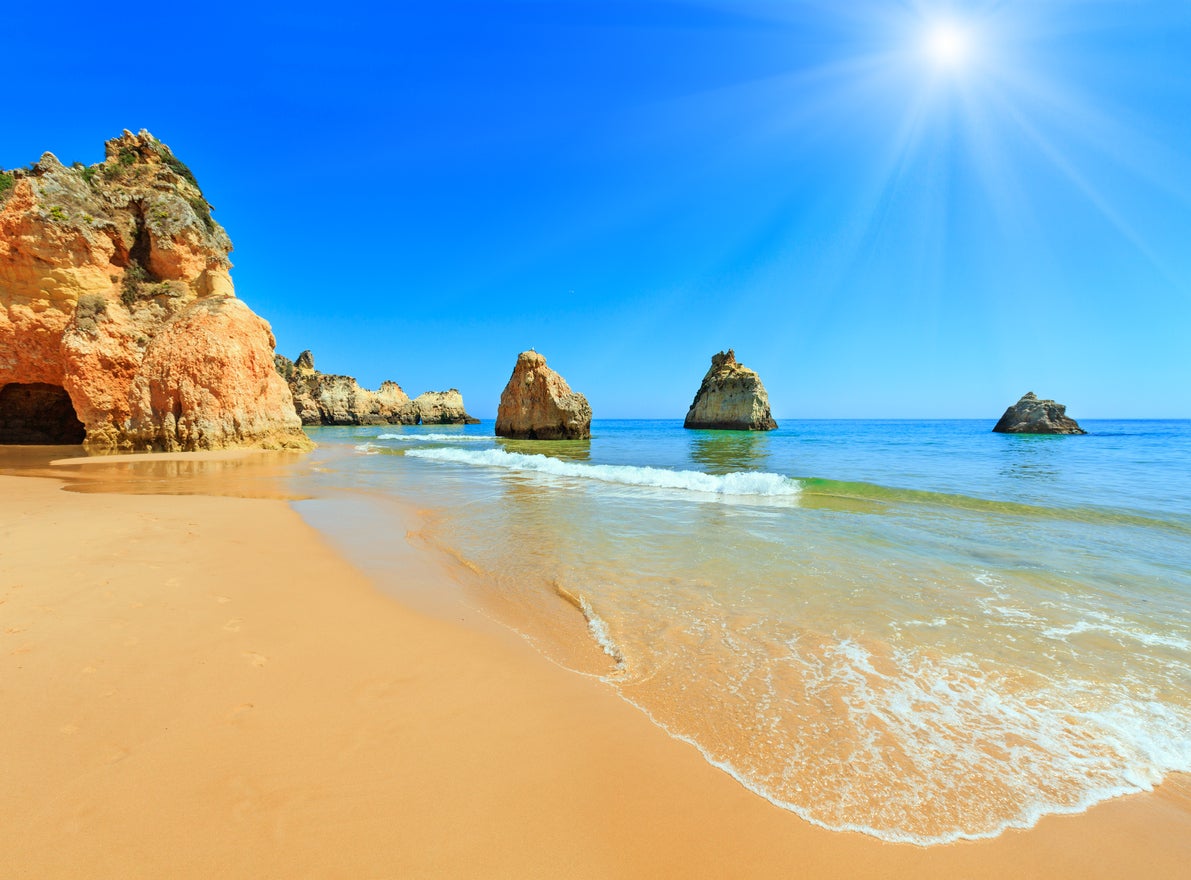 Visit the caves in Carvoeiro and walk along the Praia de Marinha cliffs