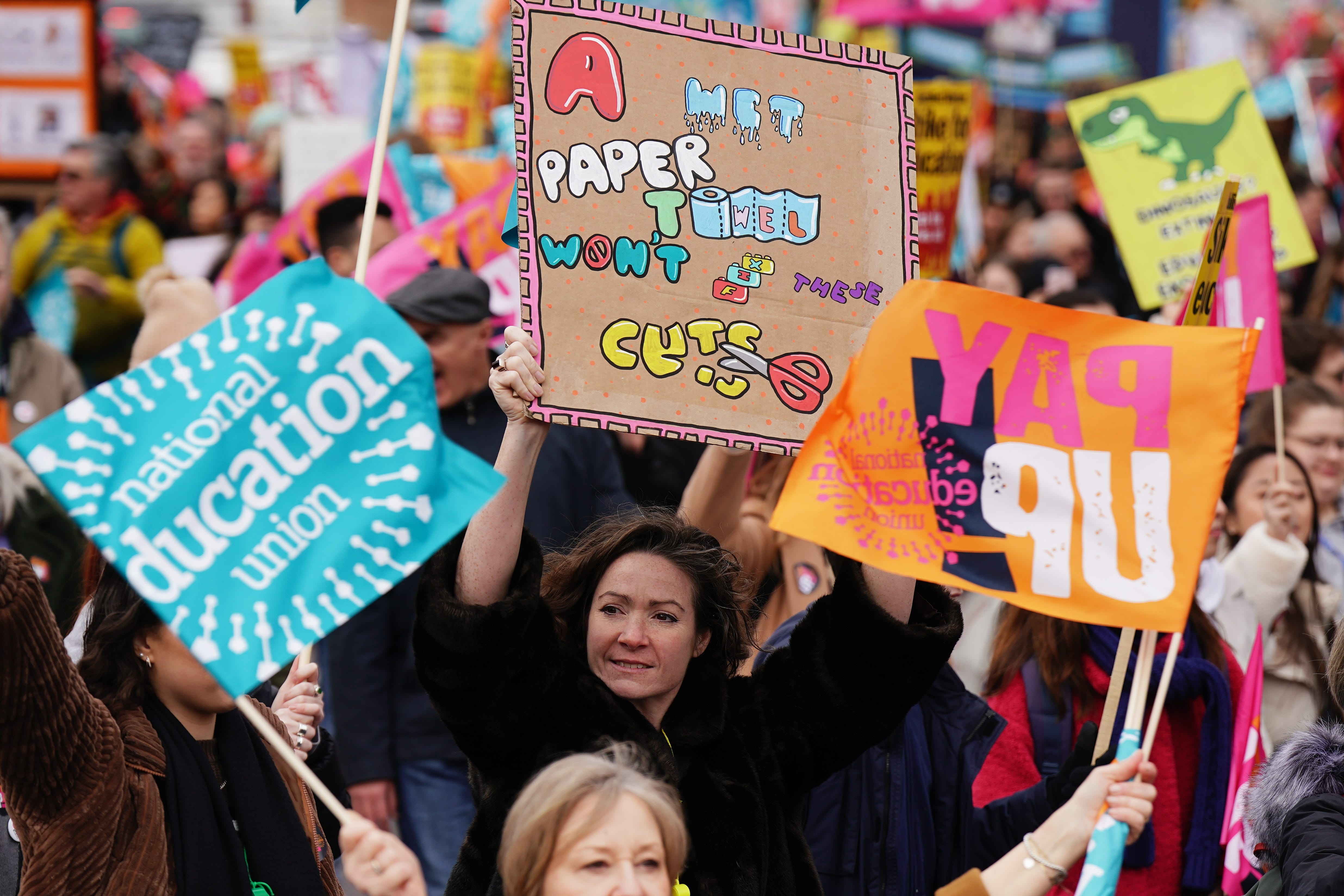 Striking members of the National Education Union (NEU) on Park lane march to a rally in Trafalgar Square, central London, in a long-running dispute over pay. Picture date: Wednesday March 15, 2023.