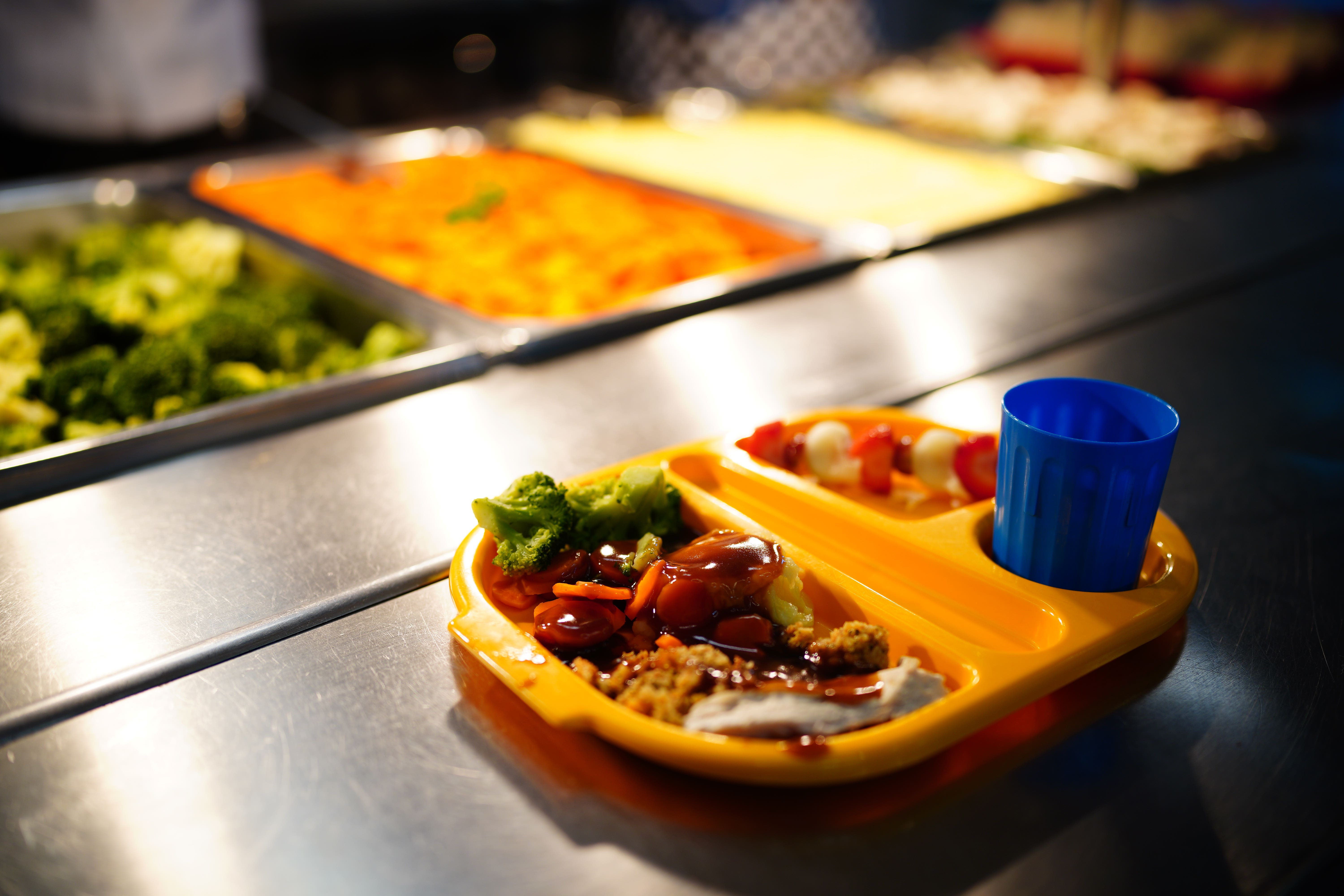 Schools face a growing gap between the funding for infant free school meals and the costs of food, ministers were warned (Ben Birchall/PA)