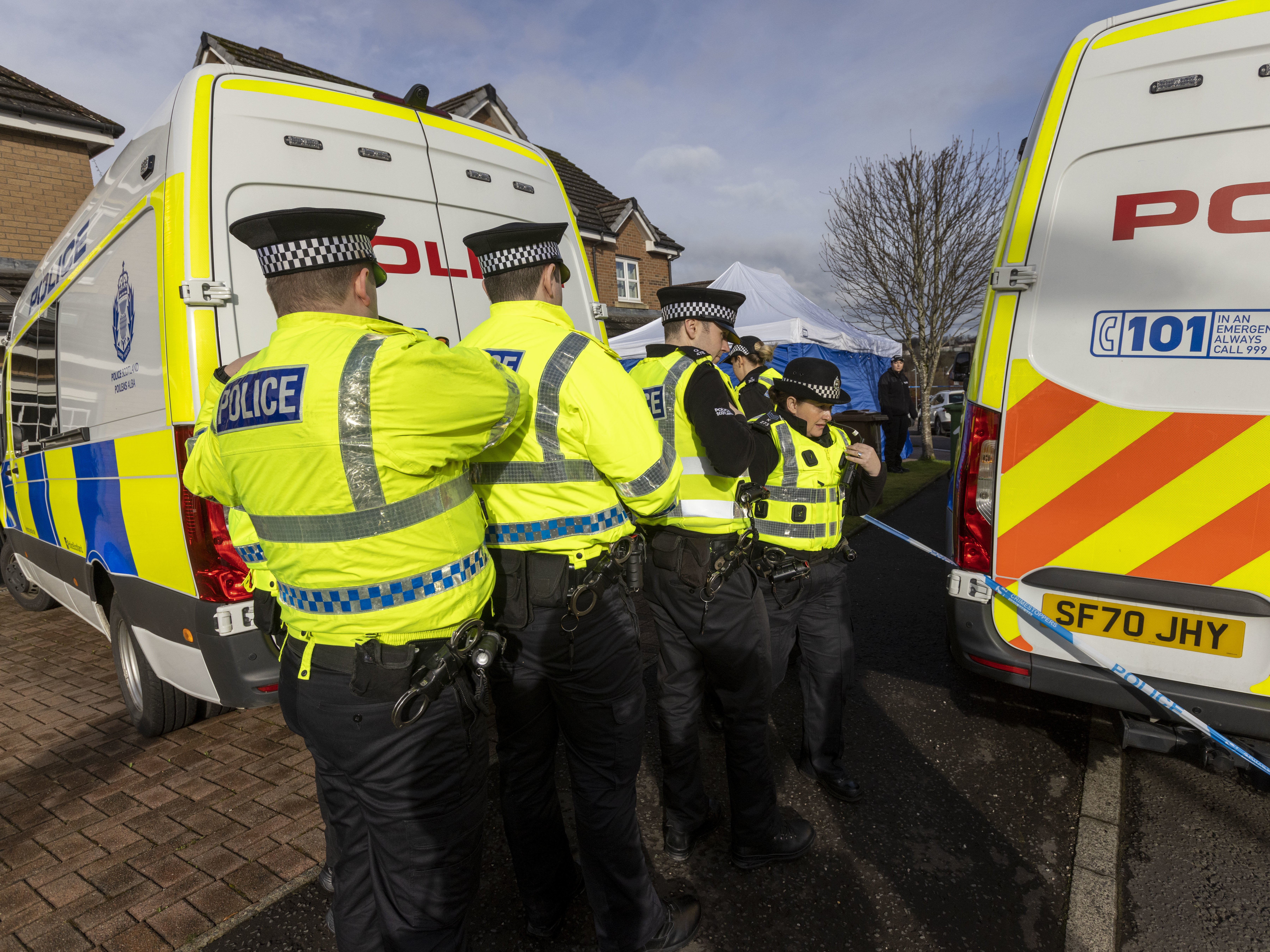 Officers outside the home of Nicola Sturgeon and former SNP chief executive Peter Murrell