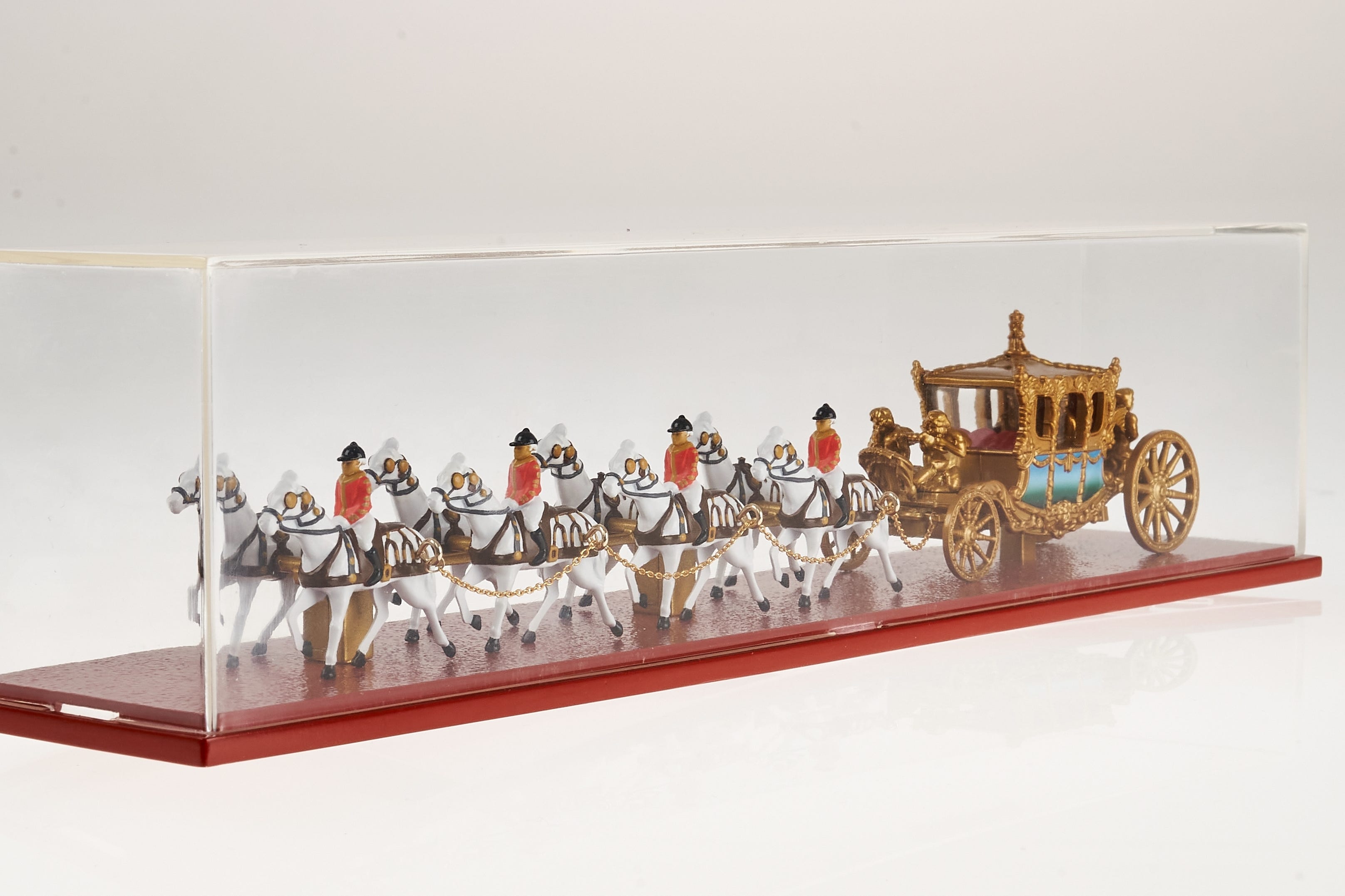 The miniature Gold State Coach by Matchbox (Matchbox/PA)