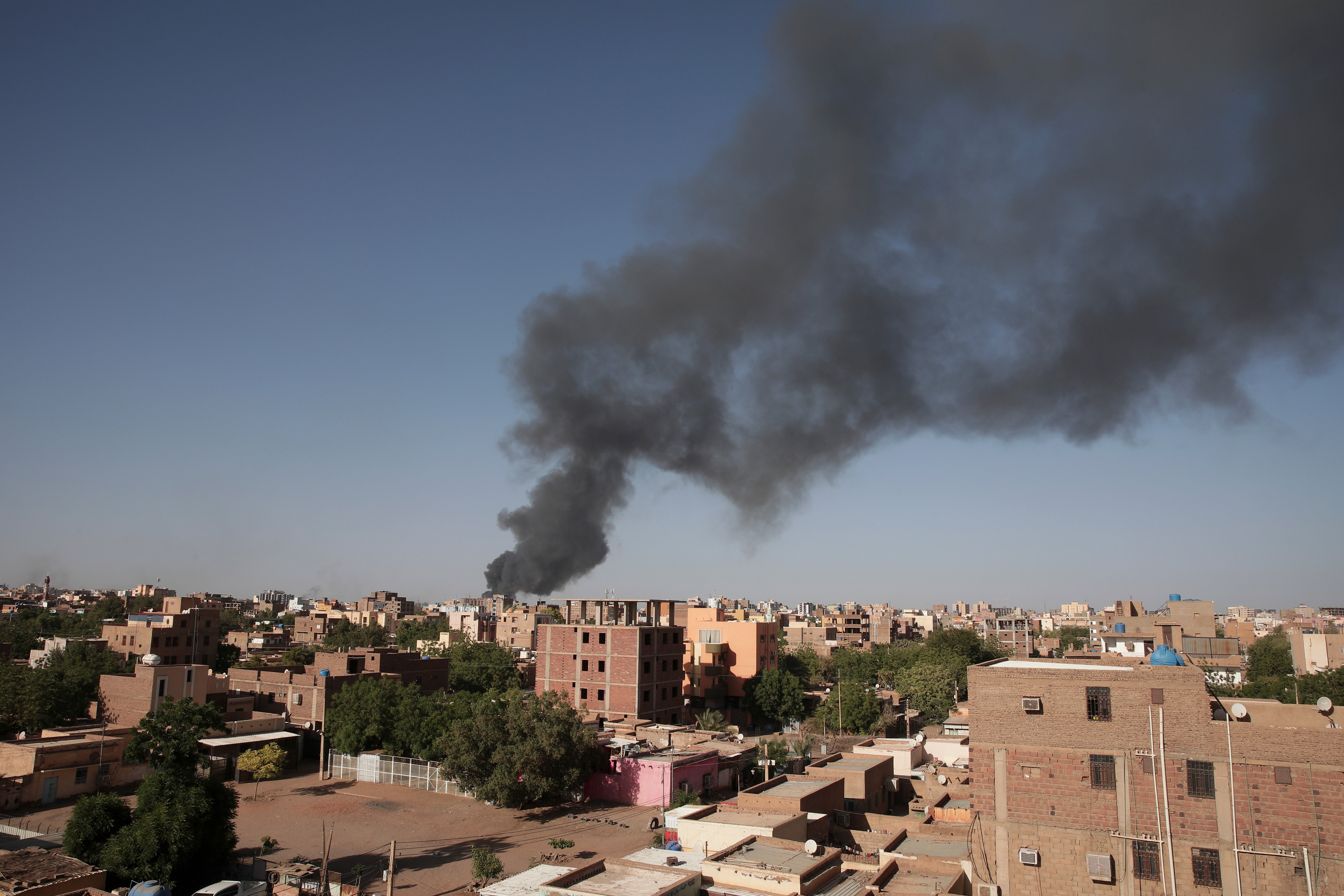 Smoke is seen in Khartoum as warring factions try to seize control of the country