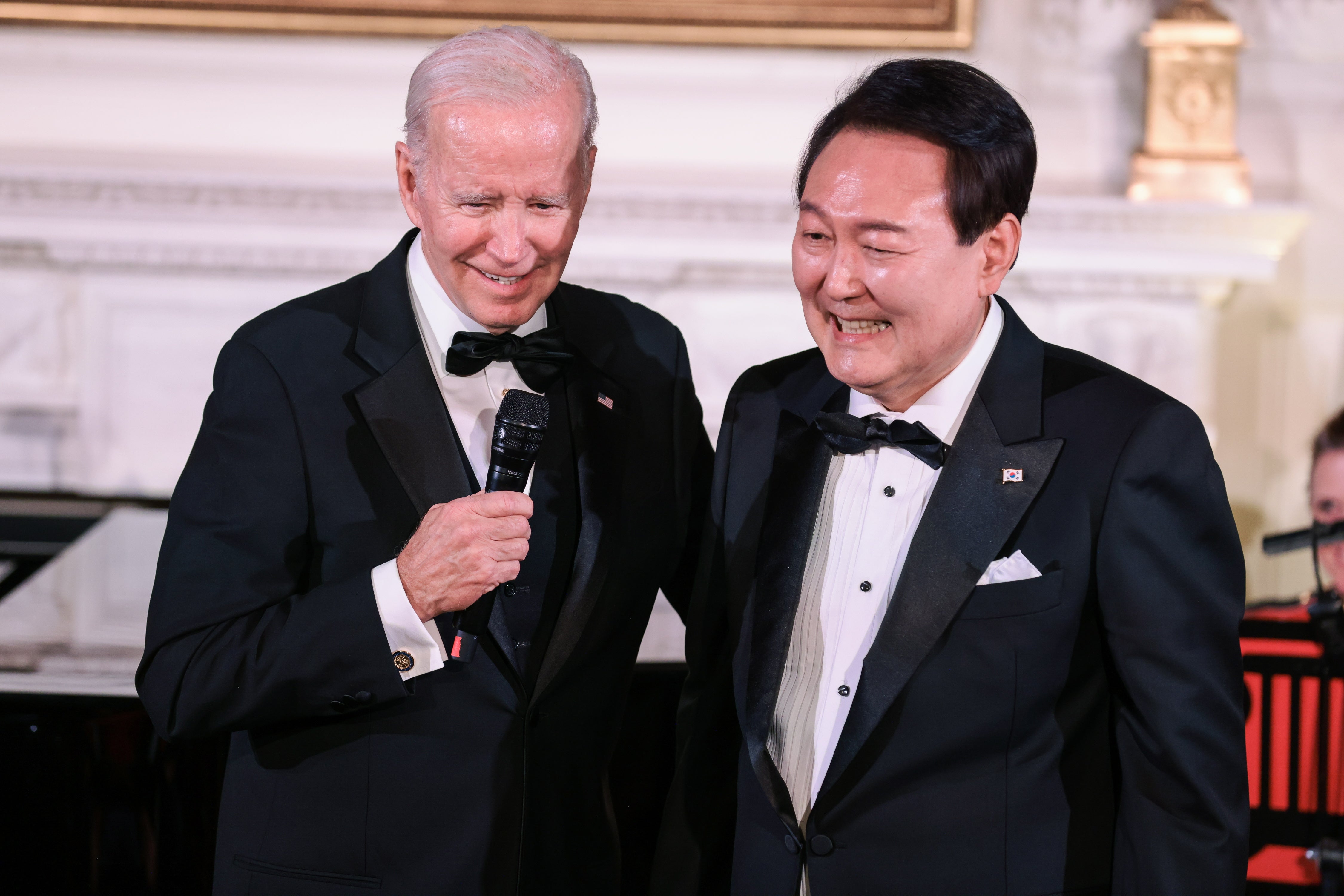 South Korean president Yoon Suk-yeol of the Republic of Korea holds and US president Joe Biden speak during the State Dinner held in the East Room of The White House