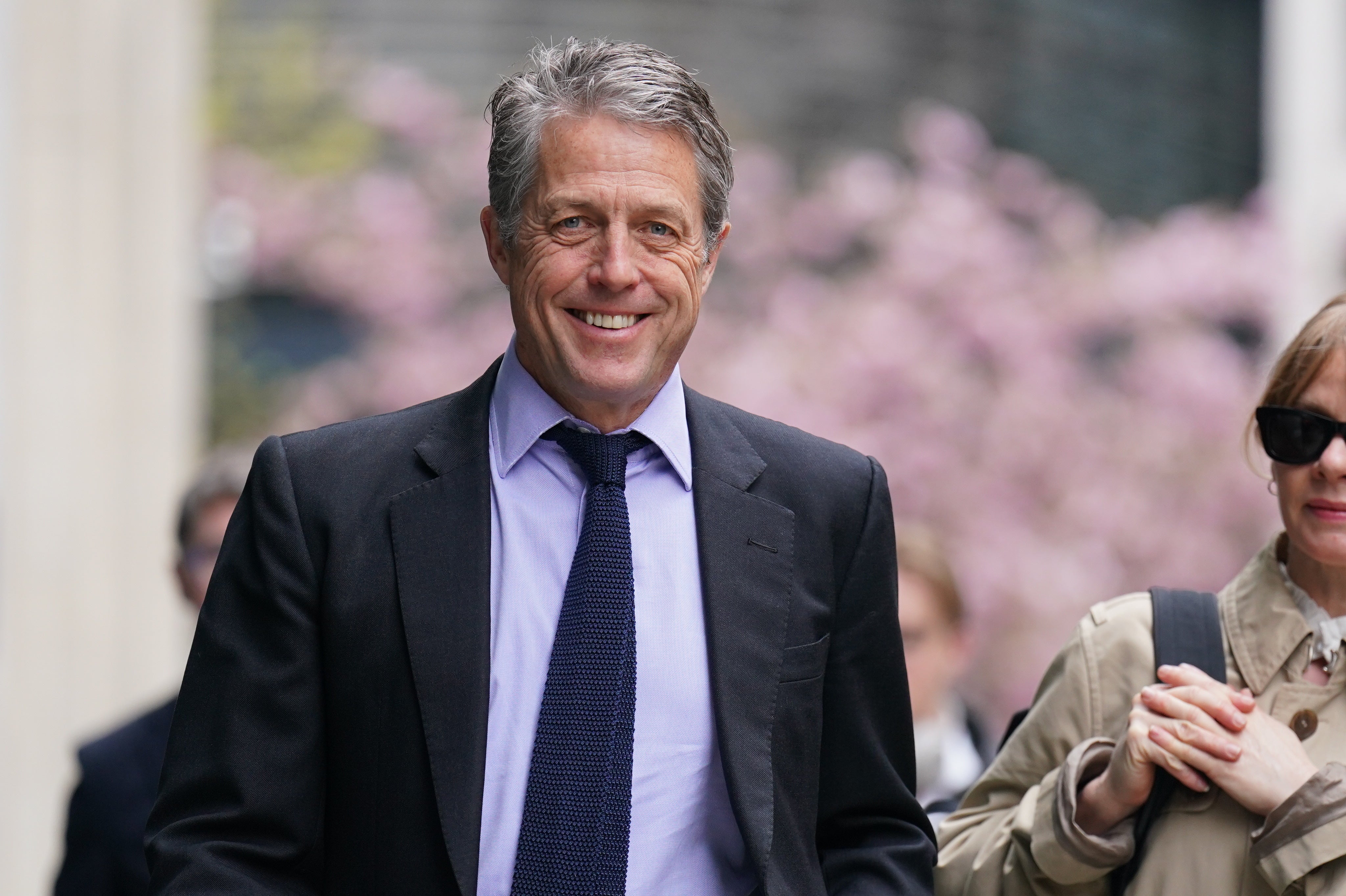 Hugh Grant arrives at the High Court on Thursday