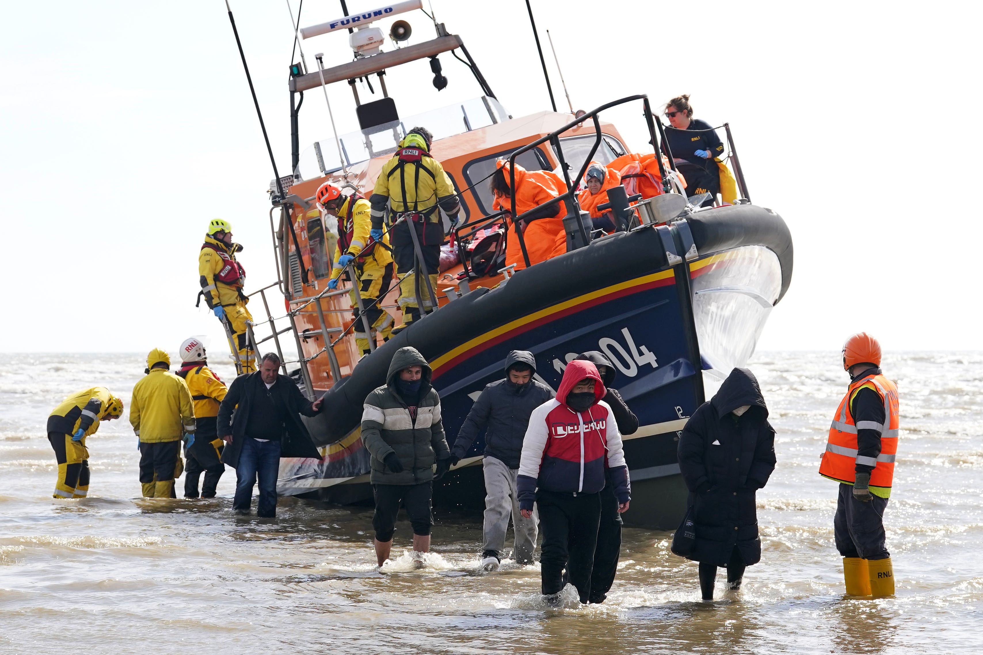 A group of people thought to be migrants are brought in to Dungeness (Gareth Fuller/PA)