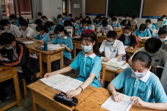 <p>File. Students wear face masks as they study in a high school in Wuhan, China, in 2020</p>