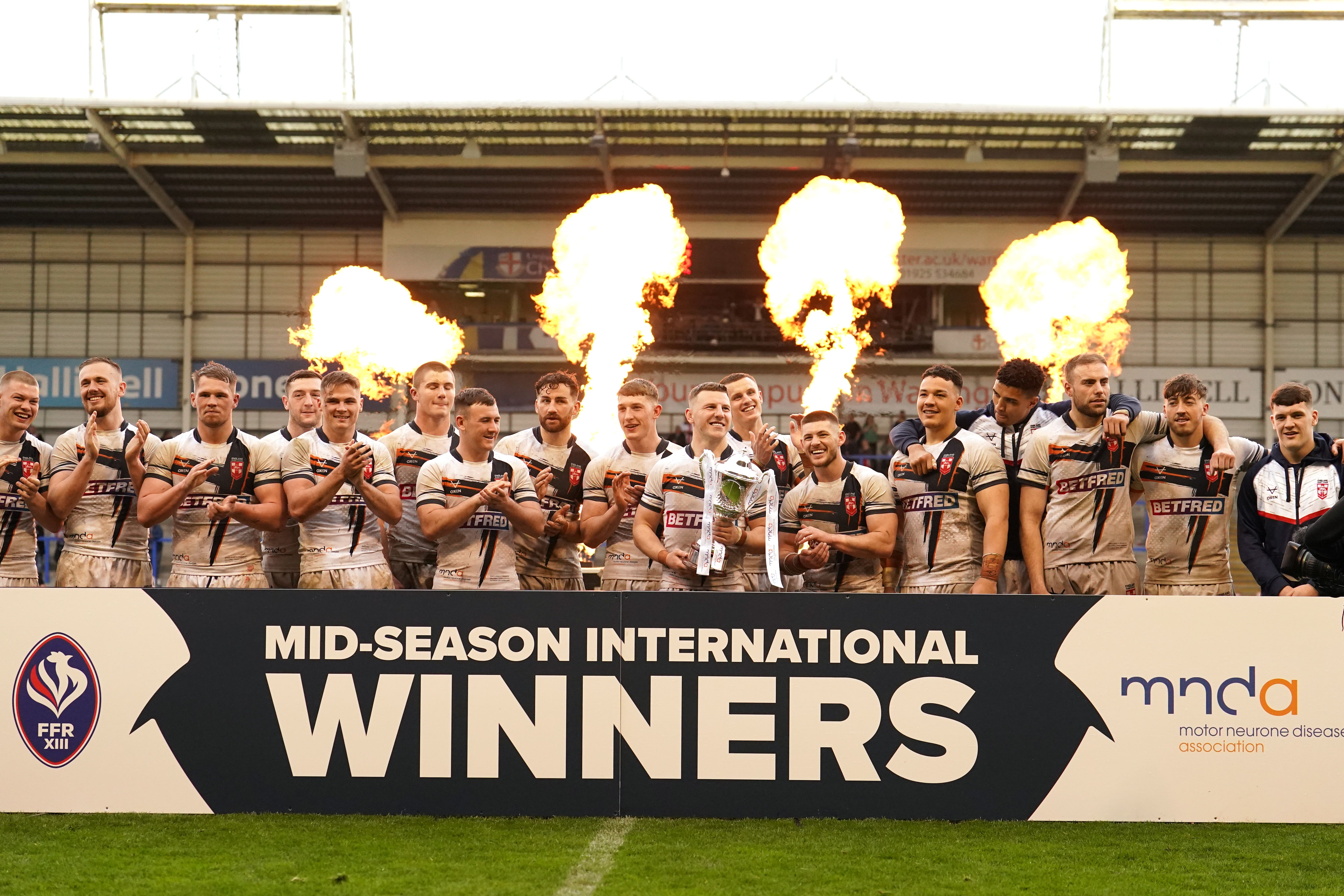 England celebrate their victory over France (Martin Rickett/PA).