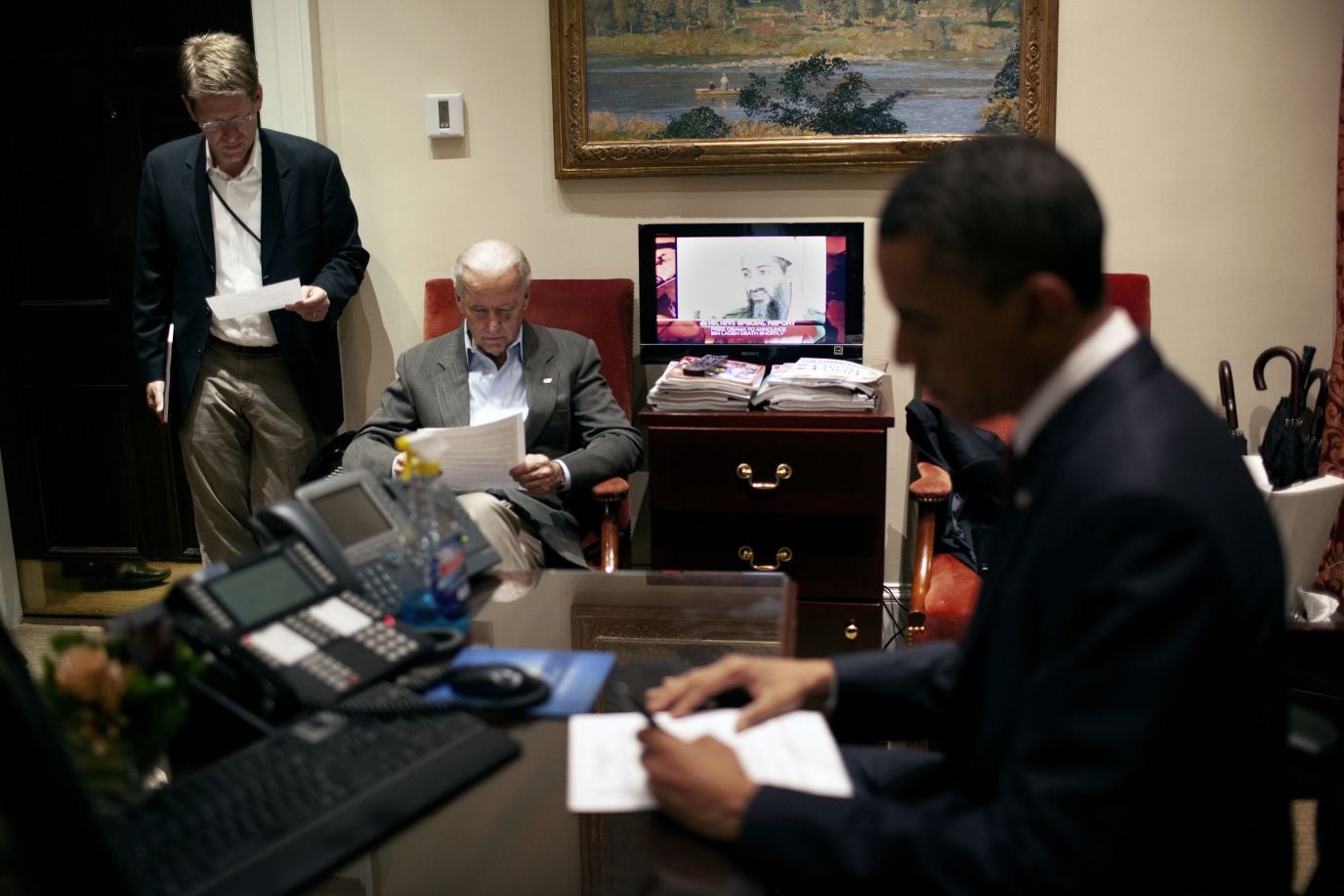 Then-President Obama and Vice President Biden engrossed in briefing materials