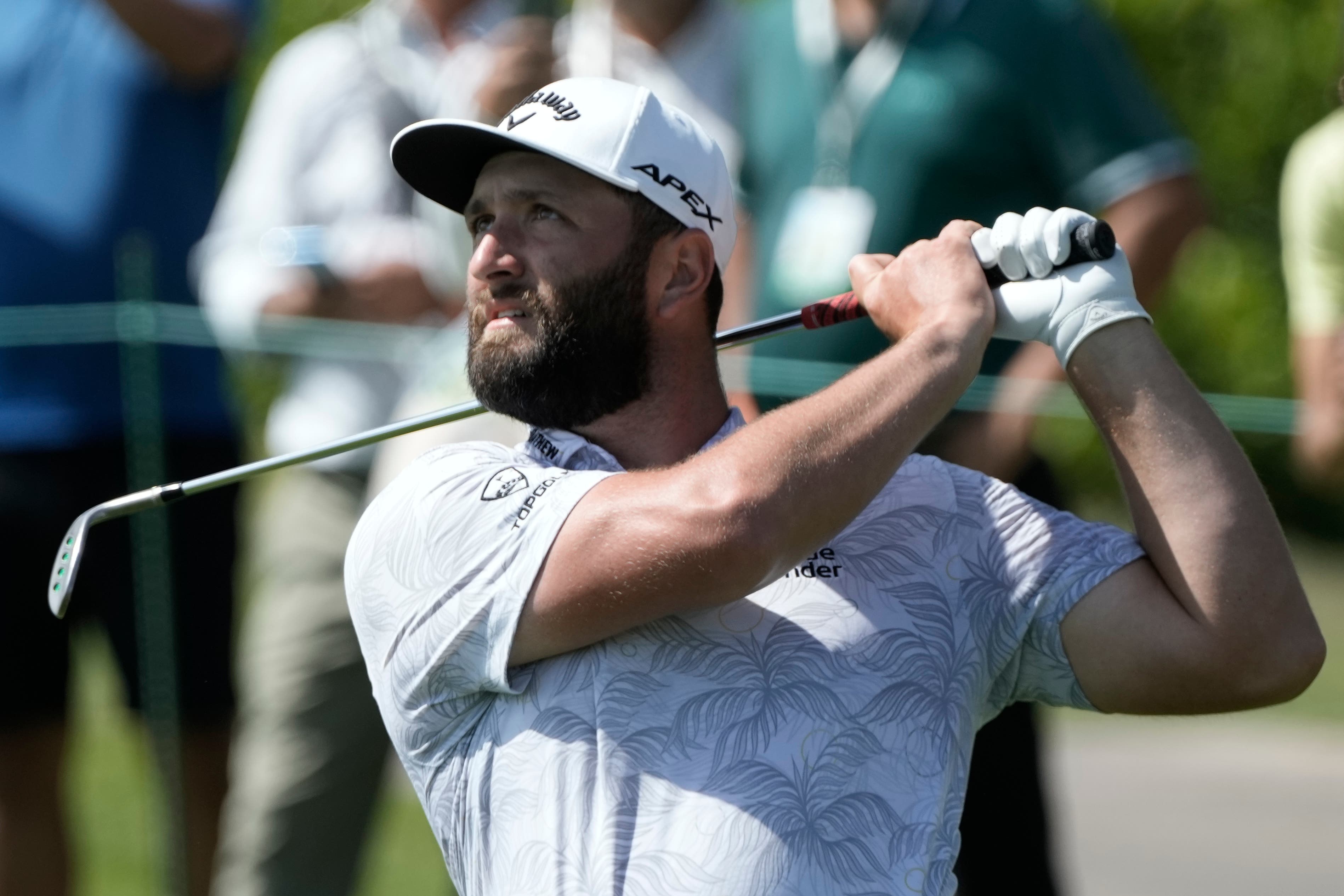 Jon Rahm watches his shot on the first hole (Moises Castillo/AP)