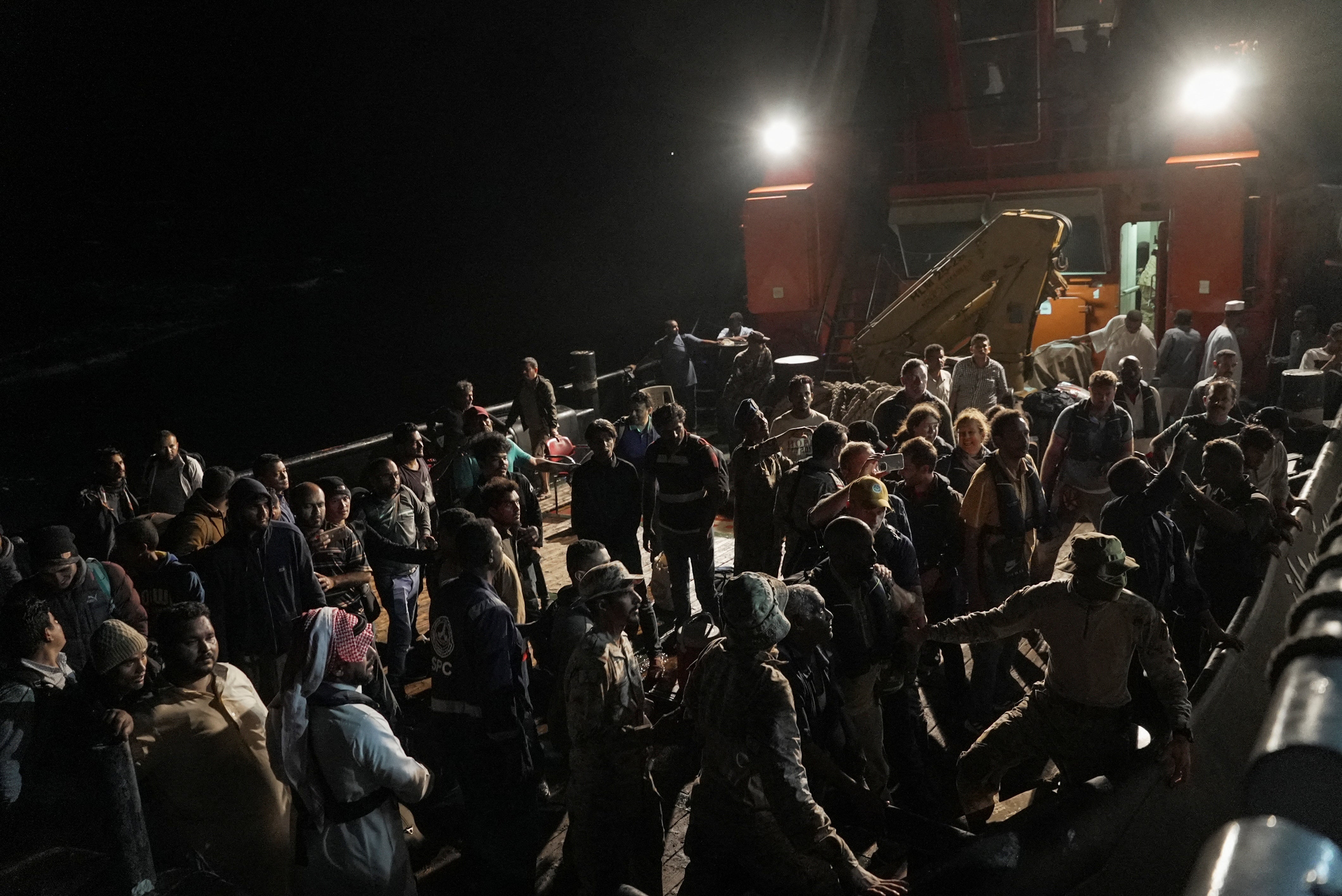 Civilians wait at sea port to be evacuated from Sudan to escape the conflicts, in Port Sudan