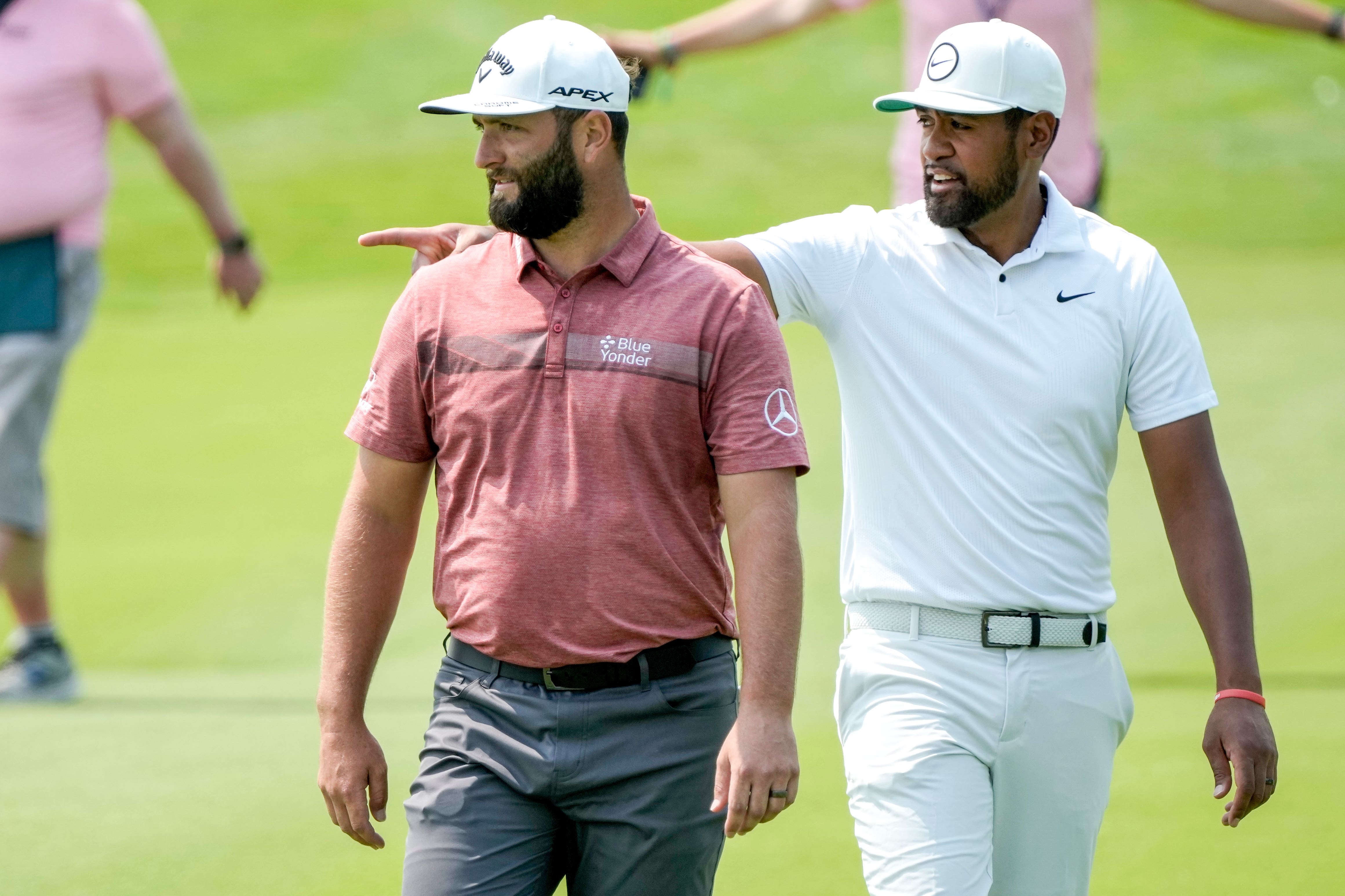 Tony Finau (right) held off defending champion Jon Rahm to win the Mexico Open (Moises Castillo/AP)