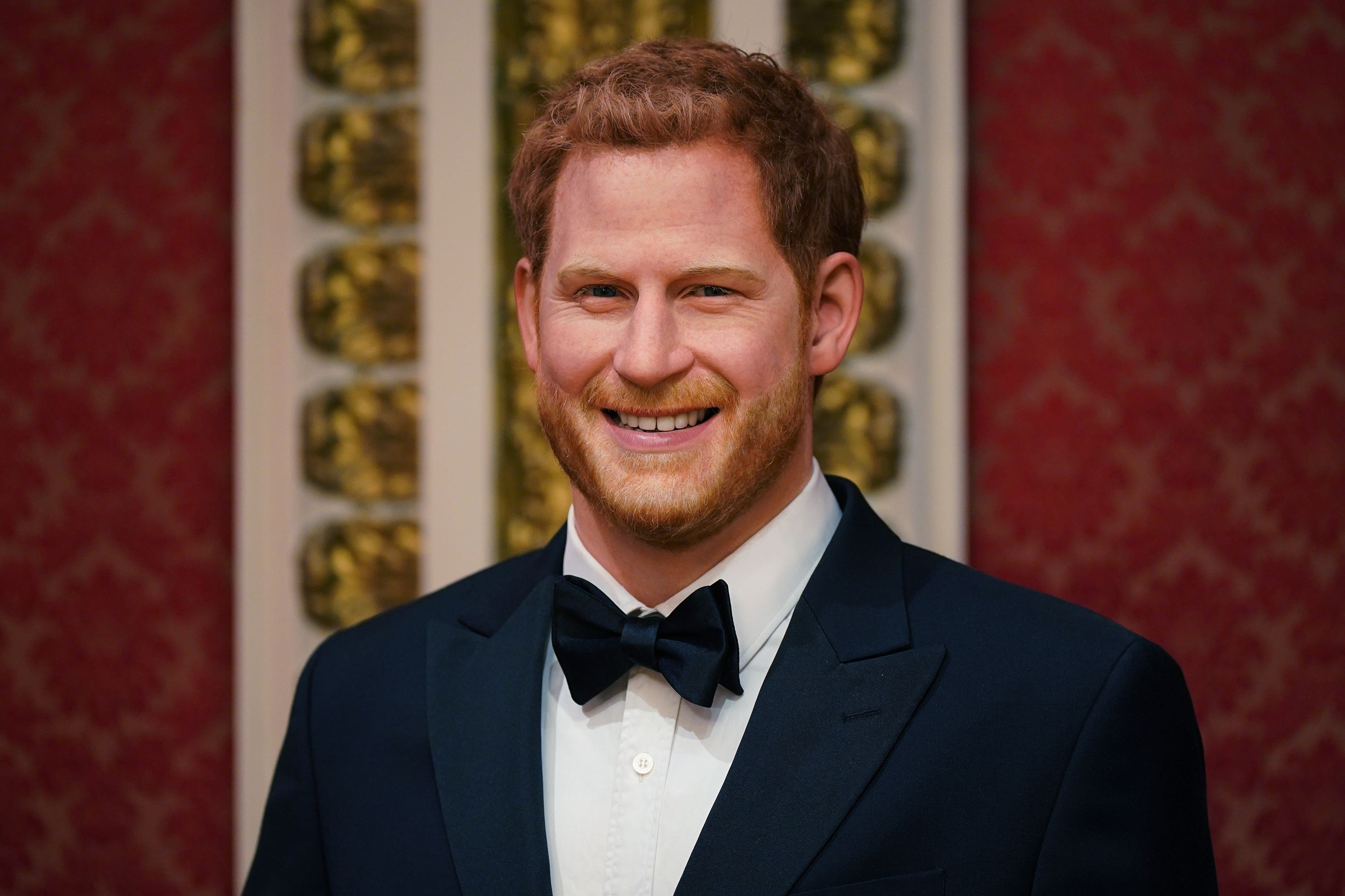 A wax figure of Harry is moved back on to display alongside other members of the royal family (Yui Mok/PA)